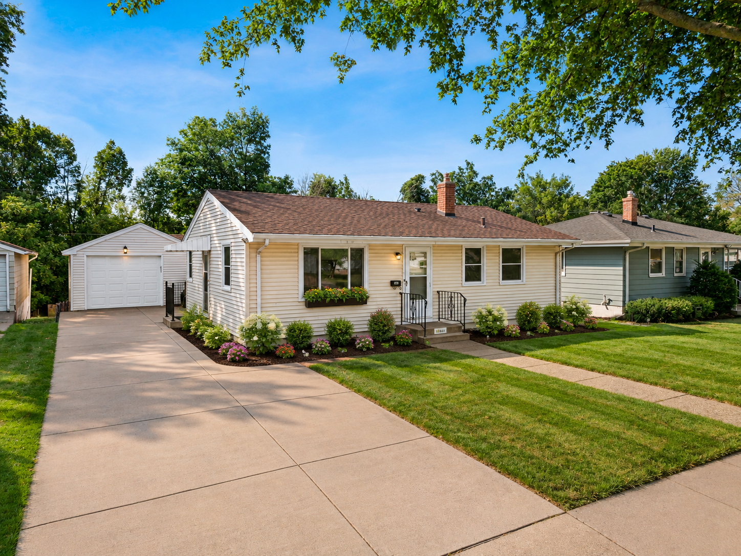 Welcome to this charming one-story home tucked away in a quiet St. Paul neighborhood! The spacious living room welcomes you with a large front-facing picture window that fills the space with natural light and highlights the original wood floors. The updated kitchen features plenty of white cabinetry, quartz countertops, and stainless steel appliances, with an open layout flowing seamlessly into the dining room. From the dining room, step through the patio door onto the impressive 25x10 deck overlooking the spacious, tree-lined and fully fenced backyard—perfect for relaxing or entertaining. Just off the deck, a three-season screened porch connects to the 1½-stall detached garage, adding even more functional living and entertaining space. Two main floor bedrooms feature original wood floors and share an updated ¾ bath with a convenient walk-in shower. The main level is finished with classic white trim and three-panel doors throughout. The finished lower level offers a comfortable recreation room and additional ¾ bath, while a versatile flex space could easily be used as a non-conforming bedroom or converted to a conforming bedroom with the simple addition of an egress window. An unfinished laundry room and storage room provide plenty of space for organization, hobbies, and all your storage needs. A wonderful blend of classic character, thoughtful updates, and flexible living space!