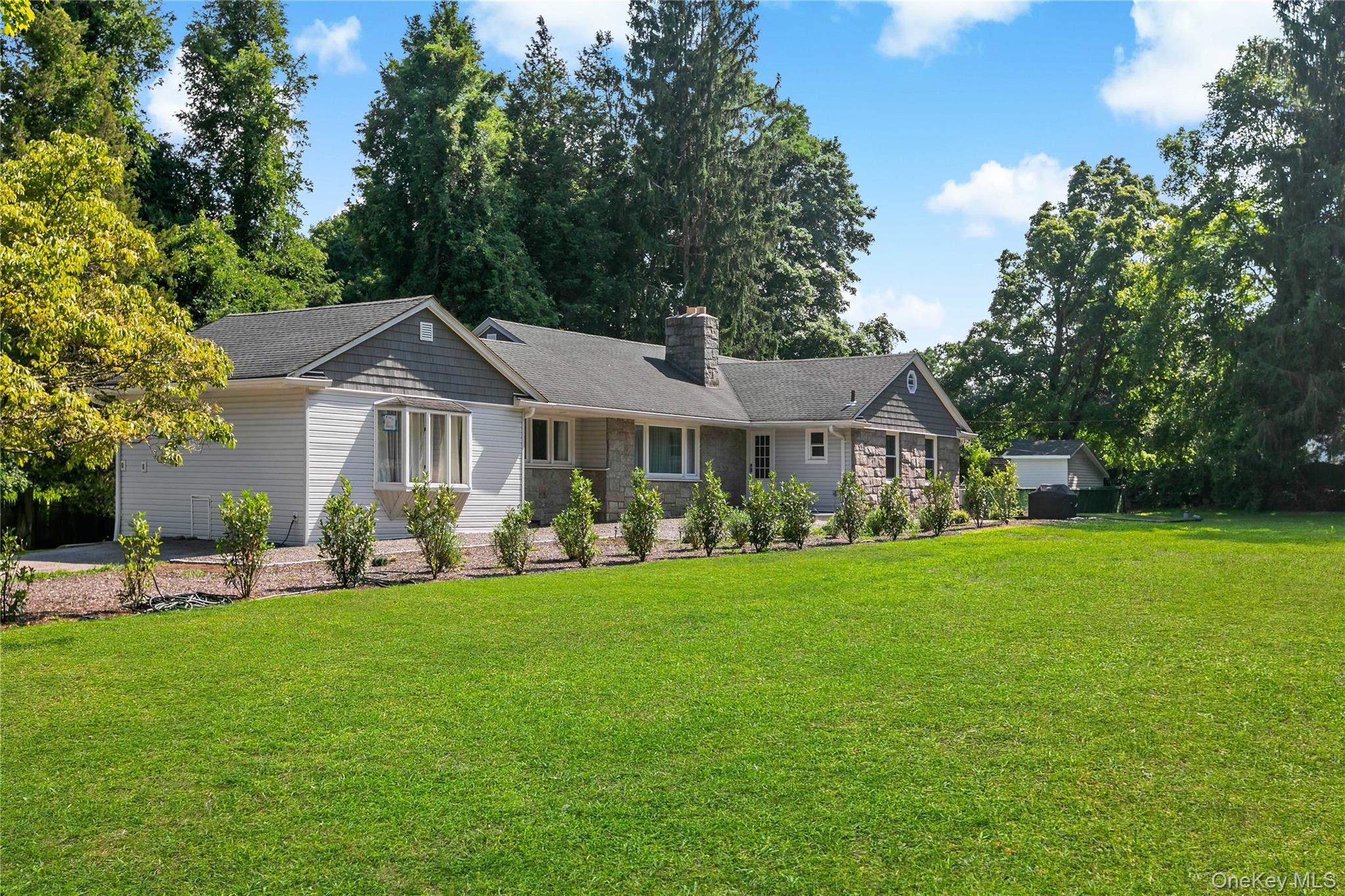 Beautifully set on a level, fully usable 2-acre property in one of Armonk's most desirable locations, this exceptional home offers the perfect blend of privacy, modern updates, and everyday convenience. A rare second access from Creemer Road provides added flexibility and ease of entry.Designed for today's lifestyle, the home features an open-concept floor plan with hardwood floors, abundant natural light, and spacious living areas ideal for both everyday living and entertaining. The recently finished 1,384-square-foot walk-out lower level, complete with a full bath and direct outdoor access, provides exceptional additional living space perfect for a recreation room, home office, gym, guest suite, or media room.The private backyard is a true retreat, highlighted by an in-ground pool surrounded by expansive, level grounds with endless possibilities for recreation, gardening, or future enhancements.Extensive recent improvements include a new roof (2019), updated siding and gutters (2018), interior painting (2026), bathroom renovations (2025), new pool pump (2024), new pool filter (2025), 80-gallon hot water heater (2024), and a new electrical service panel (2023) wired for an EV charger. Additional features include central air conditioning, propane cooking, and a Special Features Sheet and survey available in the documents. Lives like 4 BRS.Enjoy the best of Armonk living, just minutes from the charming downtown village with its boutique shopping, acclaimed restaurants, cafes, parks, and year-round community events. Located within the highly acclaimed Byram Hills School District, this home also offers convenient access to the North White Plains Metro-North station with approximately a 48-minute express commute to Grand Central Terminal, as well as nearby Westchester County Airport and major parkways for effortless travel.Move-in ready and offering the ideal combination of space, location, and lifestyle—this is a rare opportunity to own a beautifully updated home in one of Northern Westchester's most sought-after communities. —don't miss it!