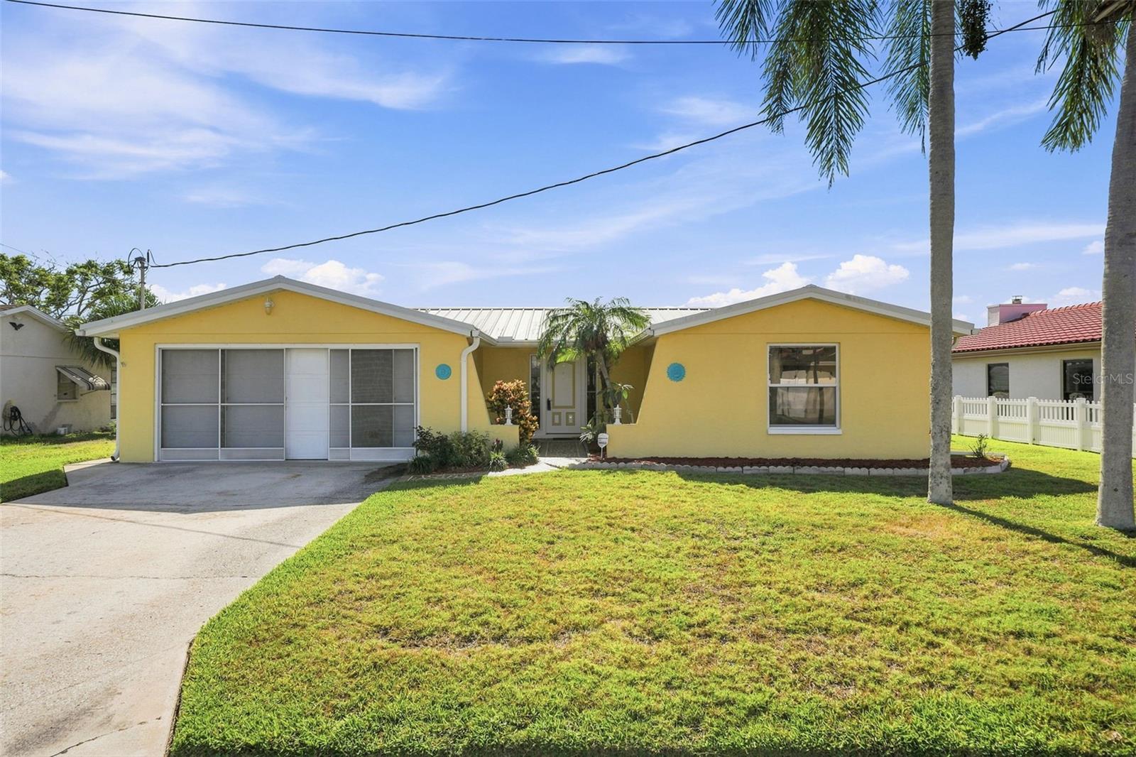 Under contract-accepting backup offers. There's something refreshing about a home that doesn't try to tell you who it should be. Instead, it gives you the space to make it your own. With 80 feet of seawall completed in 2018 and direct Gulf access, life on the water starts just beyond your backyard. Inside, the open floor plan is spacious. Over 2000 square feet, there's ample room to reimagine the layout, including the potential for a third bedroom if desired. A new 2025 A/C, metal roof, RV and generator hookup, primary bathroom remodel and a real wood-burning fireplace provide the practical features that are hard to find in a single property. If you've been waiting for a waterfront property with solid bones, endless potential, and a seller ready for the next chapter, this may be the opportunity you've been hoping for.