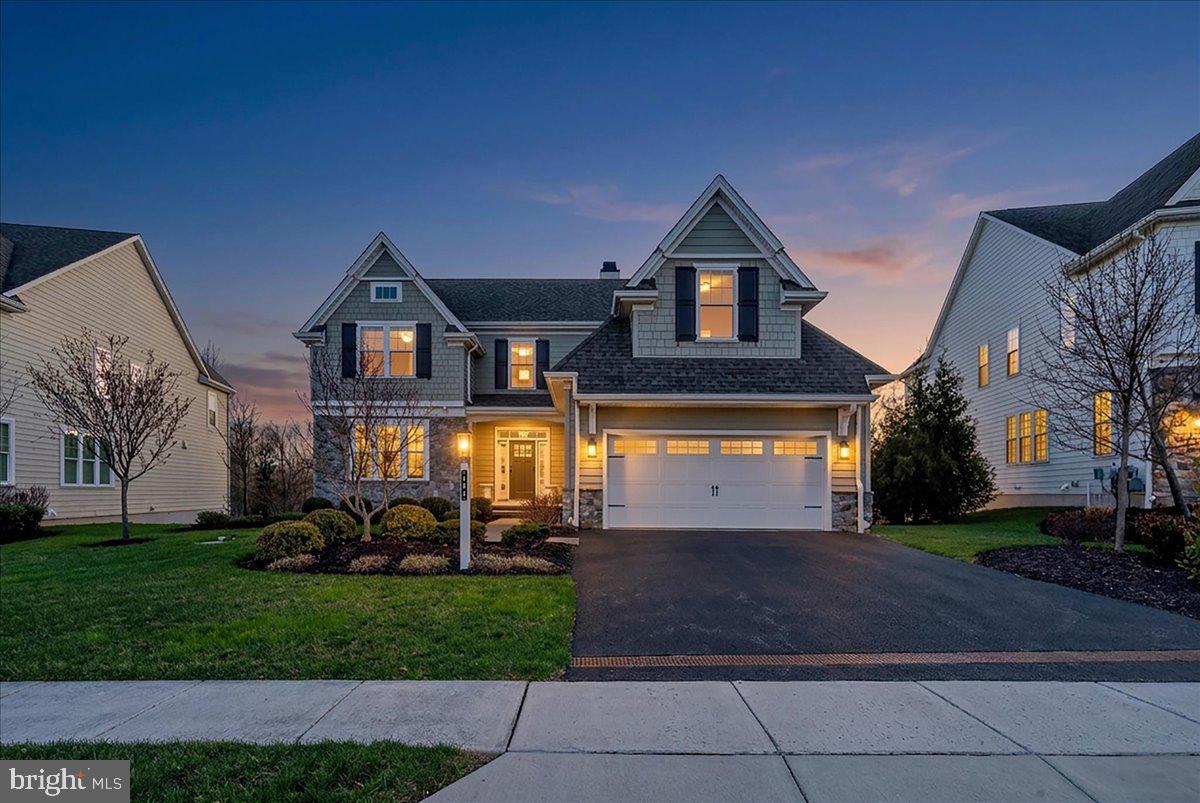 Proudly presenting this highly upgraded and sophisticated home in the award-winning community of Chapel Hill. Perfectly positioned on a premium lot backing to lush greenery and just steps from a scenic walking and biking trail, this residence offers a peaceful, turnkey lifestyle; simply unpack and enjoy.Rich, dark hardwood floors greet you as you enter the home, complemented by an abundance of windows which fill the space with natural light. Just off of the foyer, a warm and inviting library features a cozy fireplace with white marble surround and custom built in shelving  on either side; perfect for quiet moments or a refined home office.The heart of the home is the stunning open-concept gourmet kitchen and family room. Designed for both everyday living and entertaining, this space showcases a coffered ceiling with wood beams, a fireplace, and custom built-ins. The kitchen is beautifully appointed with a large center island with seating, pendant lighting, and a bright breakfast nook. There is a  luxurious primary suite on the main floor and it is a true retreat, featuring two spacious walk-in closets and a separate dressing room. The spa-like en-suite bath offers a soaking tub, dual vanities, and an elegant, serene atmosphere. Just beyond, a lovely sunroom with wood stove, provides the perfect transition to the outdoor deck, creating seamless indoor-outdoor living. A convenient first-floor laundry room adds to the home’s thoughtful design.The second floor features another primary suite; two additional bedrooms and a jack and jill bath, providing comfort and privacy for family or guests.The expansive lower level is an entertainer’s dream, offering a kitchenette, two generous living areas, a second office, a dedicated workout room, and ample storage space, ideal for today’s flexible lifestyle needs.Out back, enjoy ultimate privacy with mature greenery and tranquil views of the Abbey, along with access to a one-mile walking and biking trail.From the moment you walk through the front door, you’ll feel right at home; just drop your bags and start enjoying everything this exceptional property has to offer.