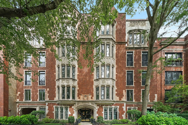 An elegant and graciously proportioned prewar residence awaits in this beautifully maintained boutique Gothic-style elevator building. Ideally located just two blocks from the lakefront, and one block from shopping, coffee shops, and restaurants, this quiet Barry Avenue home offers the perfect balance of tranquility and convenience. Completely renovated throughout, this residence blends modern updates with timeless architectural character. Highlights include expansive rooms with high ceilings, original doors and French doors, original moldings, oak parquet floors, and a wood-burning fireplace. Oversized new windows invite abundant natural light throughout. The floor plan spans 2,200 sqft and features three spacious bedrooms, three fully renovated baths, plus a chef's eat-in kitchen with generous counter space, ample cabinetry, and stainless-steel appliances. Extras include a private balcony, central air conditioning, in-unit laundry, and abundant storage. Building features include an elevator, one garage parking space, plus a secure guest parking space, a large storage room and a shared gated backyard. Pet-friendly (1 pet/unit) and located within the sought-after Nettelhorst School District, this special home combines historic elegance, thoughtful updates, and everyday convenience.