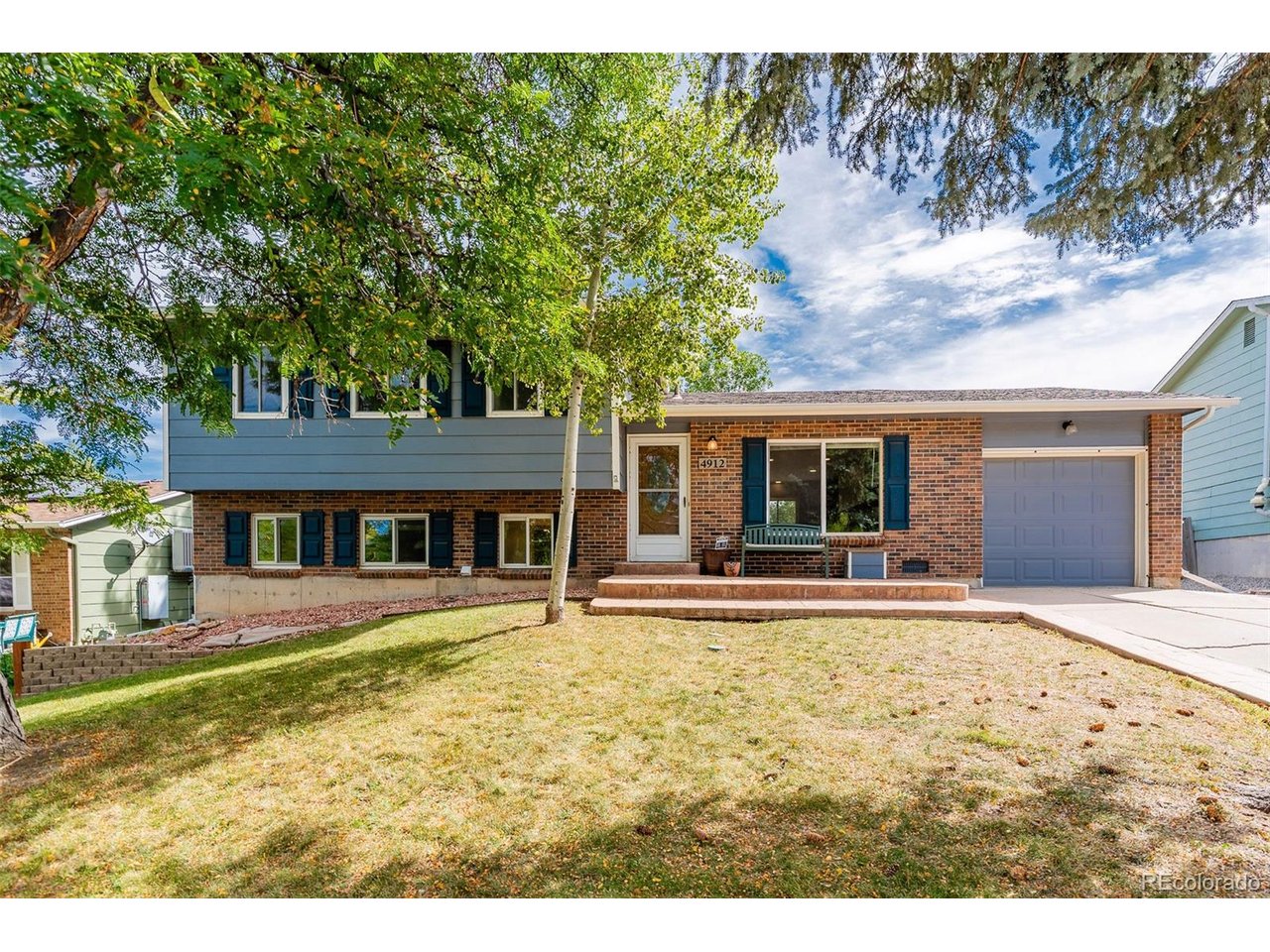 The main level of this four-bedroom Morrison home has been thoughtfully redesigned for a more open, connected way of living. A wall was removed and the former living-room space was incorporated into an expanded kitchen and dining area, creating a bright, comfortable gathering space with room for everyday meals, holiday dinners and time with friends. The updated kitchen includes granite countertops, a center island, pantry, gas range and an extra-deep French-door refrigerator, along with newer appliances except for the microwave.Major improvements extend beyond the kitchen. The furnace, central air conditioner and water heater have been replaced, both bathrooms have been updated, and most of the flooring has been renewed. Upstairs are three bedrooms, including a generously sized primary bedroom with dual closets, plus an updated full bath. The lower level offers a family room, fourth bedroom, updated three-quarter bath and adjoining laundry area-providing useful separation for guests, a home office or additional living space.Set on a landscaped 0.16-acre lot at the end of a quiet cul-de-sac, the property also offers a fully fenced backyard, front and rear sprinklers, storage shed and deep attached garage. Located in Friendly Hills with no HOA and access to Jefferson County schools, this professionally cleaned, carpet-cleaned and staged home is ready for its next chapter.