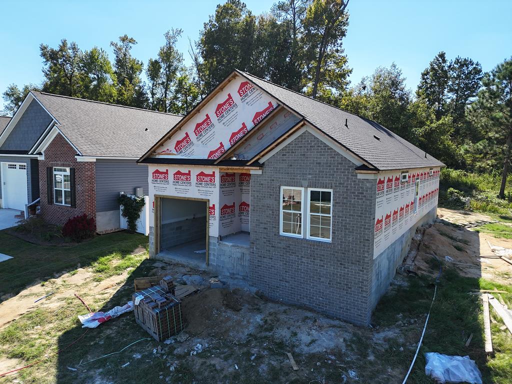 Covered porch, plus Patio for enjoying pleasant weather morning and evening in beautiful Thomasville. Newly constructed and near everything, including shopping, eating, walking and more! Will be ready soon!  Spacious single family cottage home in the desirable 55 and older Huntington Pointe Subdivision. 3 bedrooms and two baths with an enormous great room with vaulted ceiling and spacious bar separating the large kitchen filled with cabinets. Garage for safety and privacy. Lovely landscaped yard. Lots of quality extras inside this new construction home. Many want this quiet area but desire a single family home, here it is! Completion date expected October 2025