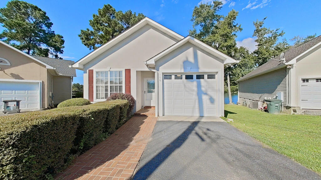 Beautifully remodeled home with a gorgeous view of the lake! This 3-bedroom, 2-bath home offers comfortable living spaces, including a spacious living room and separate den. The kitchen features new countertops, an eat-in bar, and new appliances. The walk-in laundry room is conveniently located and includes the washer and dryer, which remain with the home. Freshly painted throughout and move-in ready! The primary bedroom is located on the main floor and features a walk-in closet and beautiful lake views. Enjoy your morning coffee or unwind in the evening from the wonderful sun porch overlooking the lake. Additional features include a single-car garage and a desirable cul-de-sac location.  If you've been looking for a beautifully updated home with a peaceful setting, convenient layout, and a view you'll never get tired of, this is the one! Move-in ready and waiting for its new owners.