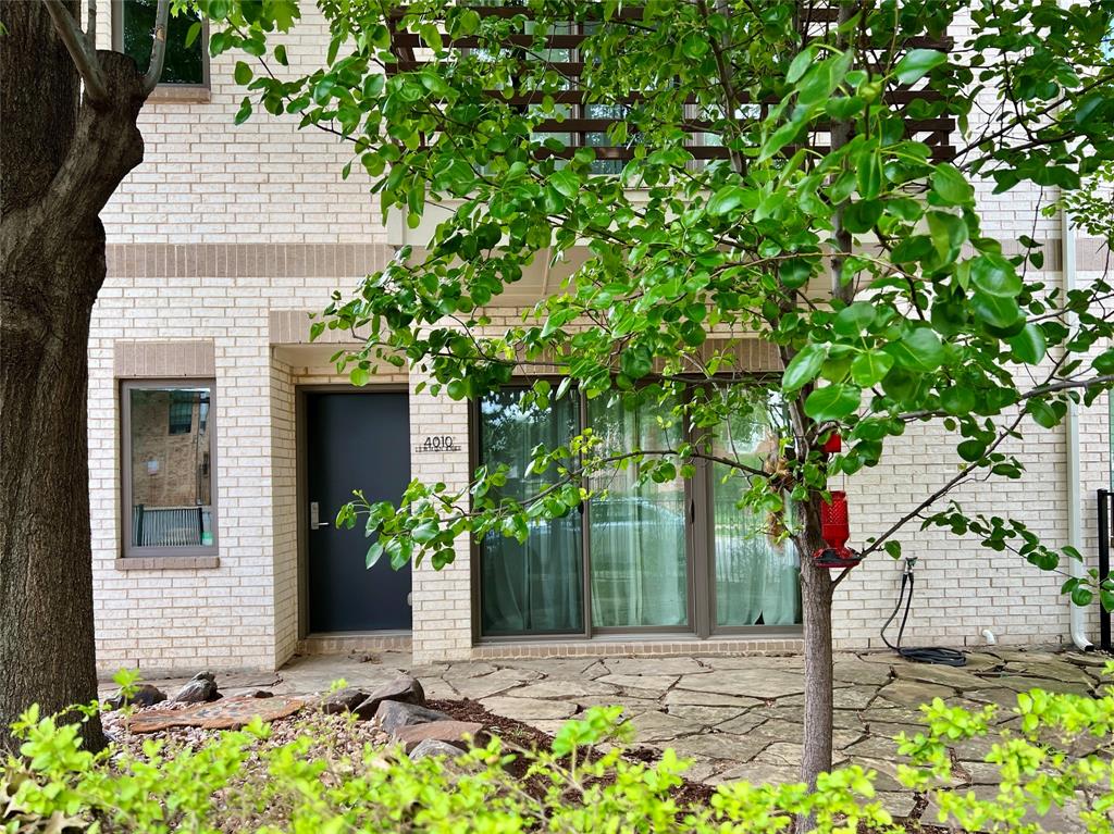 Modern corner unit with private large fenced yard in the heart of Oak Lawn! Rare opportunity to own a light-filled, move in ready home in boutique complex with exceptional walkability in one of Dallas’ most vibrant neighborhoods. This 3 bedroom, 3.5 bath home features ensuite bathrooms in every bedroom, offering ideal privacy for roommates, guests, or work from home living. Hardwood and tile flooring throughout. Bright, open concept layout with neutral finishes and floor to ceiling windows that fill the space with natural light. Chef inspired kitchen with Bosch SS appliances, oversized quartz island and countertops, abundant cabinetry, wine refrigerator, generous counter space, and large walk in pantry perfect for entertaining. Seamless flow between kitchen, dining and living room areas enhances everyday living. Enjoy outdoor living on the spacious balcony with a peaceful, treehouse like feel. First floor flex space with full bath ideal as a home office, guest suite, gym, or third bedroom. Upstairs, primary with 2 large walk-closets, guest bed and ensuite bath & utility room. Additional highlights include attached oversized garage and fresh interior paint. Washer, dryer, and refrigerator included. Seller has already paid Special Assessment of $5,250. for electric privacy gate at end of the driveway. Prime Oak Lawn location near Uptown, Turtle Creek, and the Medical District with quick access to the Dallas North Tollway, I 35 and Love Field. Close to top dining, coffee shops, nightlife, parks, and shopping.