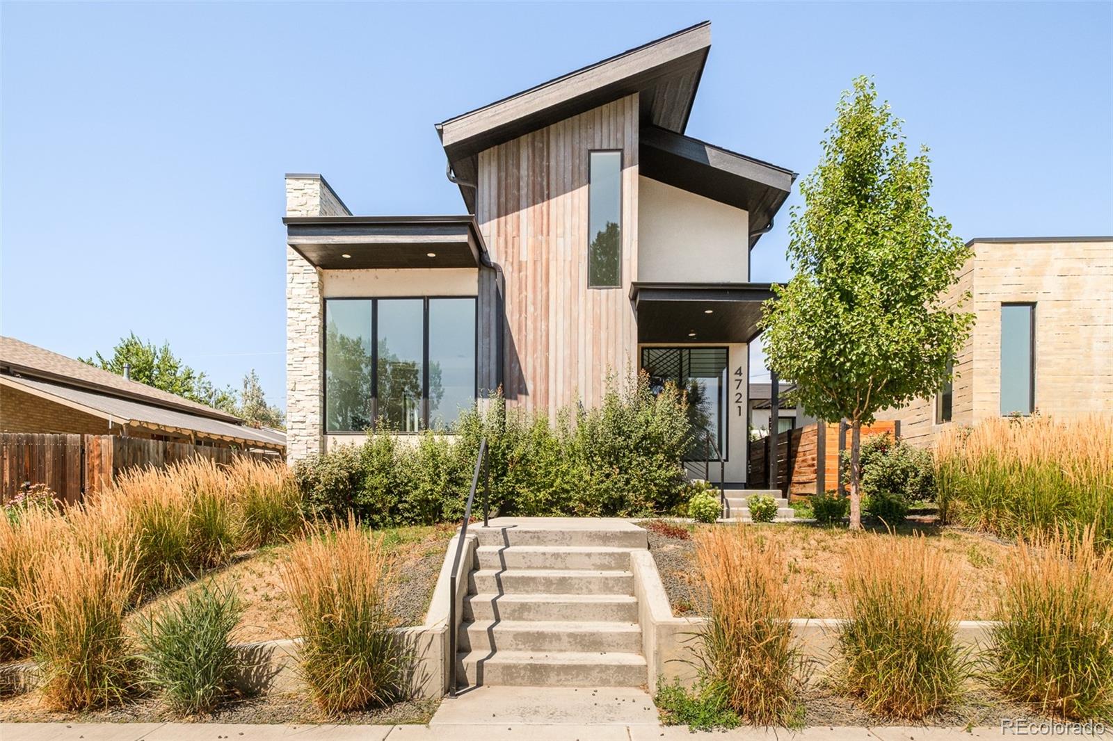 Experience elevated modern living in this newly constructed residence in the heart of Sunnyside, where thoughtful design, exceptional craftsmanship, and refined finishes come together to create a truly remarkable home. Filled with natural light, the open-concept floor plan offers an effortless flow between the living, dining, and kitchen spaces, creating an inviting setting for both everyday living and entertaining.The main level showcases soaring ceilings, designer-selected finishes, premium Porcelanosa surfaces, and expansive Marvin windows that frame the home's bright and airy interiors. A sophisticated living room with a fireplace anchors the space, while the dining area opens to a private outdoor patio for seamless indoor-outdoor living.Designed to impress, the chef's kitchen features quartz countertops, custom cabinetry, a Dacor French-door refrigerator, JennAir cooktop, and abundant prep and storage space for effortless hosting. A conveniently located main-level laundry room enhances everyday functionality.The finished lower level expands the home's versatility with a generous recreation room perfect for media, games, fitness, or gathering with guests. Additional living space provides flexibility for overnight visitors, a home office, or hobbies to suit your lifestyle.Outside, enjoy a private outdoor retreat designed for relaxing or entertaining, complemented by a detached two-car garage offering secure parking and additional storage.Ideally located just minutes from Downtown Denver, LoHi, neighborhood parks, acclaimed restaurants, breweries, and local boutiques, this exceptional Sunnyside home offers contemporary luxury, quality craftsmanship, and the convenience of one of Denver's most desirable neighborhoods.