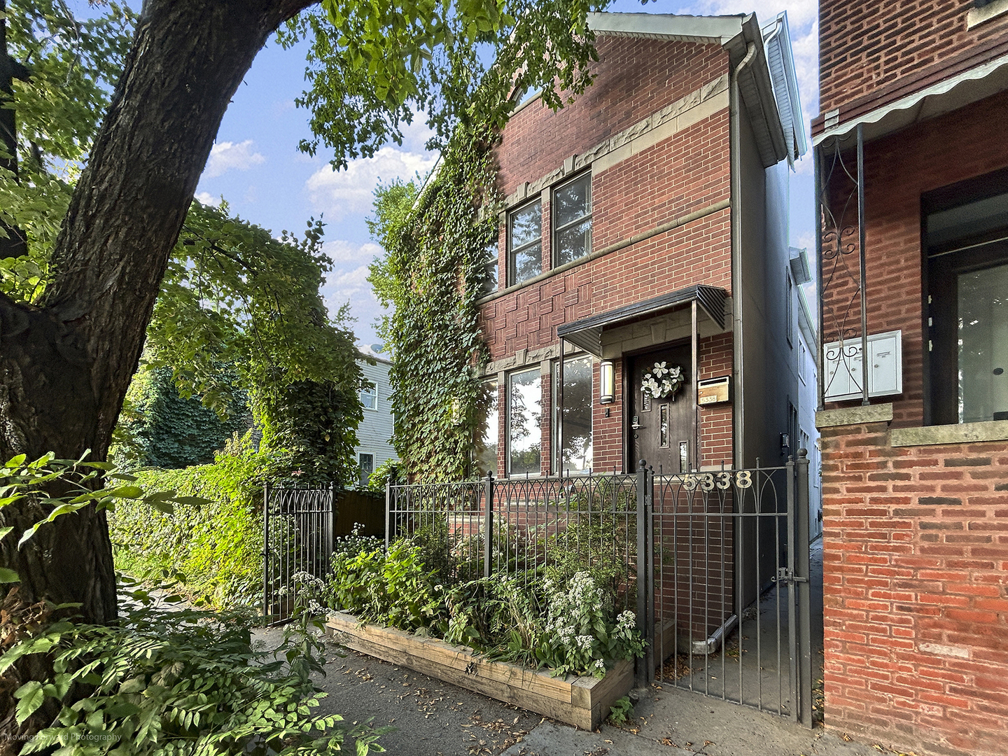 Immerse yourself in the refined elegance of this spacious single-family home, nestled in the vibrant heart of Andersonville. Just a block away from a rich tapestry of dining, entertainment, and shopping, this residence offers a perfect blend of urban living and community charm, surrounded by gardens and local culture.  The expansive formal living and dining areas gracefully flow into an open-concept kitchen and family room, complete with a cozy wood-burning fireplace and a walk-out rear deck. The kitchen featuring granite countertops, cherry cabinetry, stainless steel appliances, a buffet, a breakfast nook, and a convenient powder-room.  Hardwood floors exude warmth and sophistication.    The master suite is a personal retreat with a room-length walk-in closet and an en suite marble bath that includes a whirlpool tub, a separate shower, and a double vanity. Two additional bedrooms share a full bath, each featuring generous closet space.    In the tiled and fully renovated basement, discover a second master bedroom along with a luxury bathroom, offering a two-person steam shower for ultimate relaxation. The home's modern electrical system is equipped for solar power, installed in 2022, reflects modern sustainability. An instant hot water system, paired with a high-efficiency tank, ensures comfort and convenience, even with guests.     The thoughtfully designed exterior drainage system guarantees a low-maintenance and dry basement, while cable access from the laundry room supports seamless entertainment and reliable Wi-Fi throughout the home. Ceiling fans in most rooms enhance energy efficiency, allowing you to enjoy the refreshing breeze from the back porch through the elegant French doors.     With a partially finished attic space that spans the entire house, currently serving as a boxing gym and storage area, you have the freedom to pursue your passions. The fully tiled lower level expands your living space, featuring an additional family room, fourth bedroom, full bath, mudroom, and ample storage. This home is not just a residence; it's a canvas for a vibrant and fulfilling lifestyle.