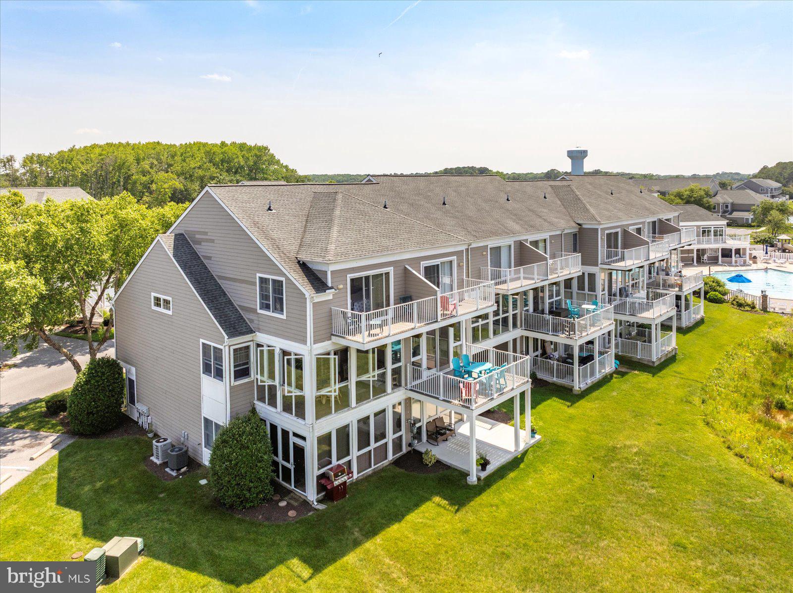 Incredible Opportunity at the New Price of $679,000 for 38277 Ocean Vista Dr #1180, a beautifully maintained fully furnished end unit townhome in the sought-after waterfront community of Bayville Shores in Selbyville, Delaware. Ideally located just 2.5 miles from Fenwick Island and minutes to Bethany Beach, Rehoboth Beach, Lewes, and Ocean City, MD, this Court Model offers over 2,650 sq. ft. of upgraded living space with a builder’s bump-out that enhances the open layout and natural light. As an end unit, it enjoys extra windows, added privacy, and unobstructed pond and bay views. The entry level features a spacious guest suite or second primary bedroom with a walk-in closet, en suite bath, and a bright waterfront sunroom perfect for a home office, den, or optional fourth bedroom. The main level showcases 9' ceilings, hardwood-style flooring, and a sun-filled kitchen with skylight, stainless steel appliances, abundant cabinetry, and bar seating. The dining area flows into the living room with gas fireplace and enclosed sunroom offering sweeping views of the pond and Little Assawoman Bay. Upstairs, the primary suite includes a walk-in closet, en suite bath with soaking tub and separate shower, and a private sundeck overlooking the water. A third bedroom with en suite bath and oversized closet completes the upper level. An attached garage provides extra storage, and the home is offered fully furnished with a stocked kitchen—ready for immediate enjoyment. Bayville Shores offers exclusive amenities for homeowners, renters, and guests secured via key fob access. Enjoy an Olympic-sized swimming pool, baby pool, sun deck, and centrally located Community Center with restrooms, showers, and on-site management. The second-floor fitness center includes cardio equipment, free weights, a Pilates bar, TV, kitchen, and community library with stunning pond views. Nature lovers will appreciate three freshwater fishing ponds (catch-and-release), three piers, and a private boat ramp with access to Dirickson Creek and Little Assawoman Bay. Kayak racks are available for seasonal rental, and a private boat storage facility accommodates vessels up to 30 feet. For recreation, there’s a full-sized basketball court, tennis court, four pickleball courts, shuffleboard, horseshoe pits, a sand volleyball court, and a playground. Scenic walking and biking paths wind throughout the neighborhood, with pondfront gazebos, a community post office, and golf cart-friendly roads. Water is included—so you’ll never receive a water bill—and the home is connected to public sewer. Enjoy low electric rates through Delaware Electric Cooperative. The HOA also covers all exterior maintenance plus flood and hazard insurance for low-maintenance ownership. Bayville Shores is partially solar powered, with panels generating over 1.5 million kWh of energy over 30 years. Short-term rentals are permitted, making this a high-performing investment property in a prime coastal location. With beautiful pond and bay views, spacious living, and unmatched community amenities, this turnkey home offers the best of coastal Delaware living.