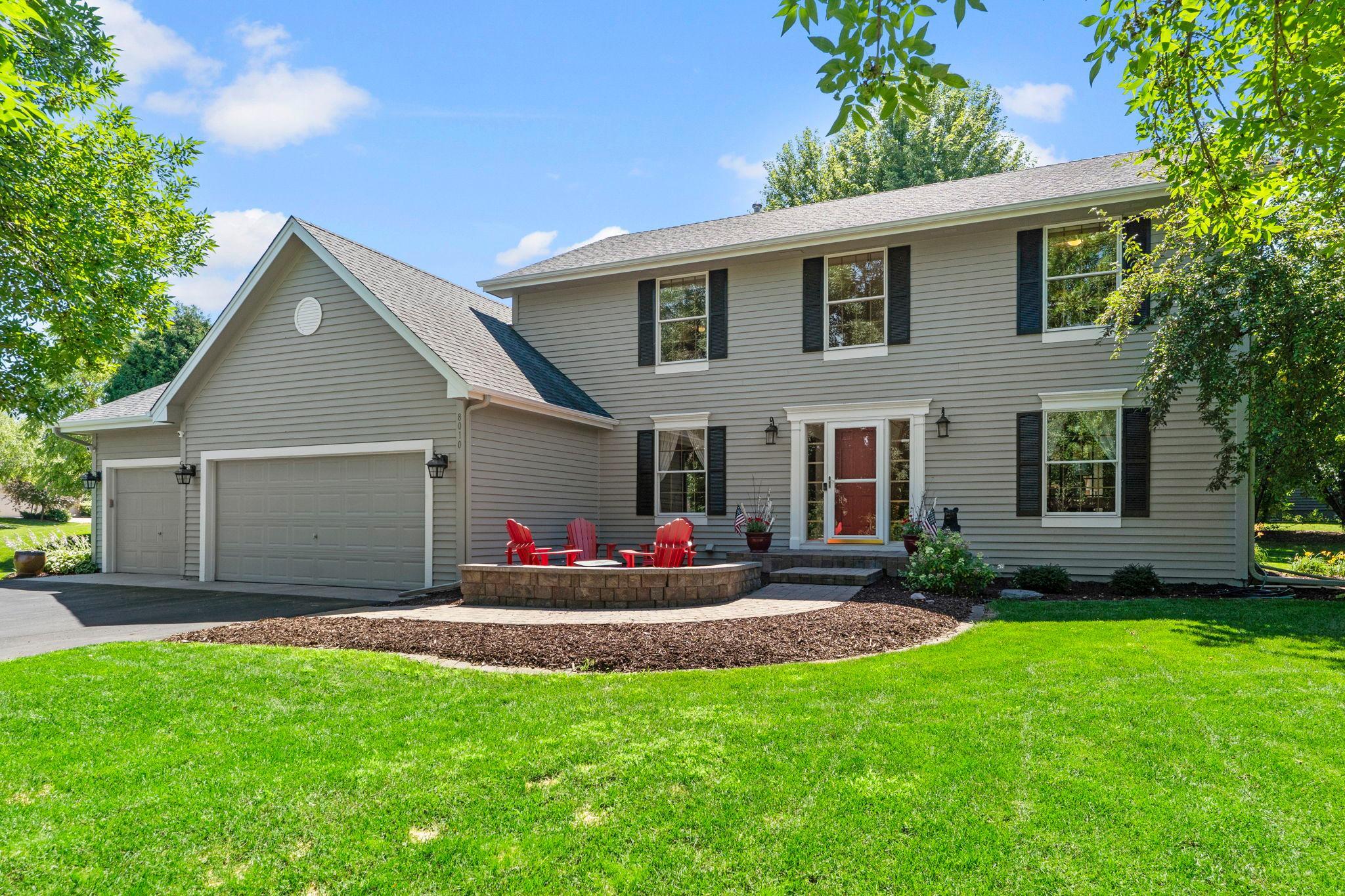 Welcome to this 4 bedroom, 3 bathroom home in Eden Prairie, minutes from shopping, dining, and entertainment, and close to nearly 10,000 acres of parks including Staring Lake Park and Round Lake Park.Step inside to a vaulted ceiling and formal dining area with updated chandelier and front yard view. The kitchen features stainless appliances, a tile backsplash, and backyard view, with access to the three car garage through the mudroom with locker storage.Off the kitchen, the informal dining room flows into the living room with a backyard view and gas fireplace with tile surround. The sitting room offers side and front yard views. Out front, a patio with built-in firepit invites you to relax.Upstairs, the primary suite includes dual walk-in closets, front and side yard views, and a private en suite with tile flooring, double vanities, a soaking tub, and picture window. Two additional bedrooms overlook the backyard, one faces front, sharing a full bath.The partially finished lower level offers a spacious family room with egress window, plus an unfinished area with rough-in for a bathroom, laundry and utility room, ideal for a future bedroom or flex space.Set on a corner lot with mature trees for privacy, this home is quiet, close to top schools, Highways 5 and 212, and 1.5 miles from downtown Chanhassen, with easy access to walking paths and neighborhood events.