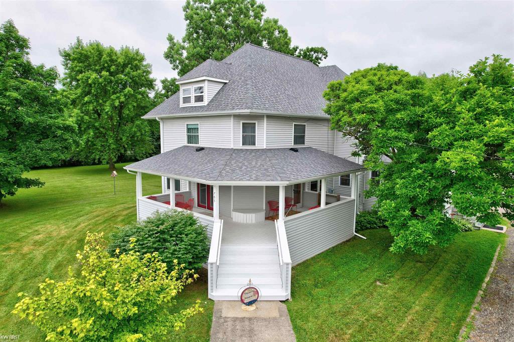 Check out your dream home under the Willows! This beautifully updated and lovingly maintained 5 bedroom, 2 full bath home rests on a combined 1.24 acres just within the edge of Davison city limits. With 2,972 sq. ft. of living space, this home offers comfort, tons of character, and modern updates. Step inside to find a spacious and flexible layout, including a main-floor bedroom currently being used as an office. The 1,486 sq. ft. Michigan basement can be used for additional storage. Both full bathrooms are generously sized - one even features a luxurious garden tub for relaxing evenings at home and serves as the 2nd-floor laundry room. The amazing kitchen, main level flooring and carpet, along with the roof and vinyl siding were ALL just updated in 2024 - making this home truly move-in ready. Plus, with a newer furnace, A/C, and water heater (all updated in 2018), the big-ticket items are already taken care of. Outdoors, you'll fall in love with the canopy of willow trees, wrap-around driveway, and spacious 3-car garage - plenty of room for vehicles, hobbies, and storage. Enjoy peaceful mornings on either of the porches or deck, including a classic wrap-around front porch with French doors and separate side porch with a cozy swing that leads to the sunroom. There's even a vacant side lot (already figured into the total acreage) and fenced backyard - perfect for pets, play, entertaining or gardening. This home truly has it all; space, style, and serenity - with room to grow and memories to be made. All measurements are approximate. Just minutes from Main St. stores and restaurants, M-15, parks, trails, schools, and all the amenities the Davison area has to offer. Don't miss your chance to make this home your own. Schedule your showing today!