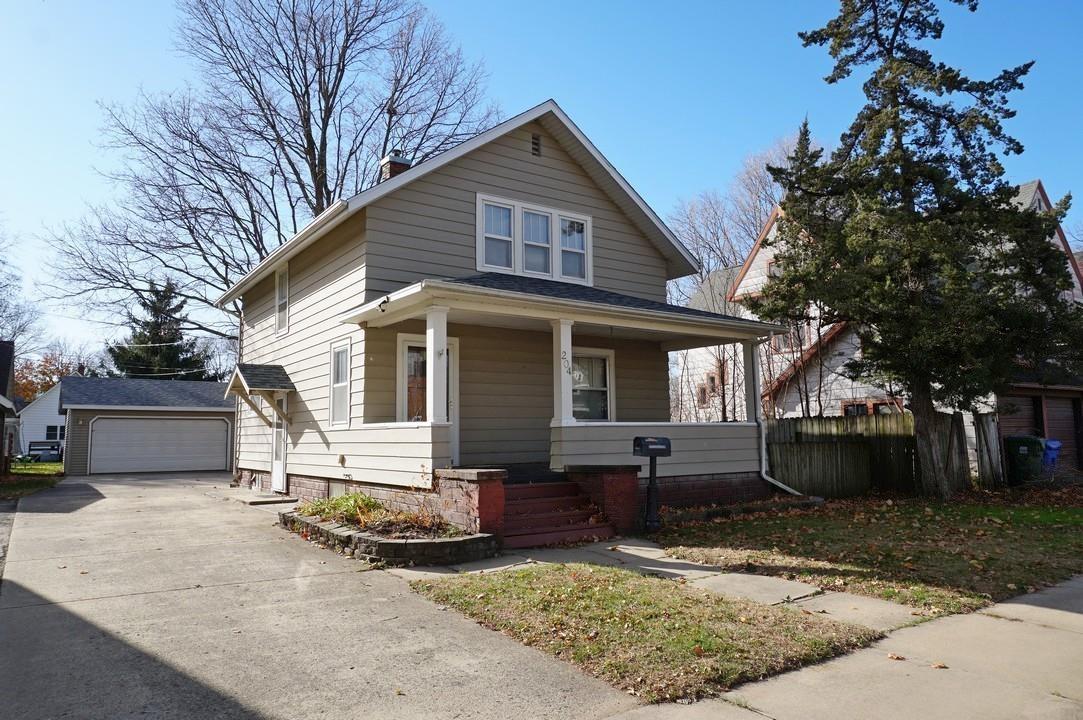 Well-cared-for 2+ bedroom, 1.5 bath home with 3-car garage! Offering 1,432 sq ft of living space, this 2-story home has a traditional floor plan with timeless details, including an open front porch, hardwood floors and millworks. The main level features a comfortable living room, dining room and kitchen. Sliding doors in the dining room provide abundant natural light and walk out to the expansive wood deck. Upstairs are two spacious bedrooms and full bath. The basement is partially finished with a non-conforming 3rd bedroom, half bath, laundry, and storage. The detached 3-car garage (30 ft x 24 ft) offers ample space for vehicles, storage and hobbies. New roof 2025. This home is ready for your personal touches!