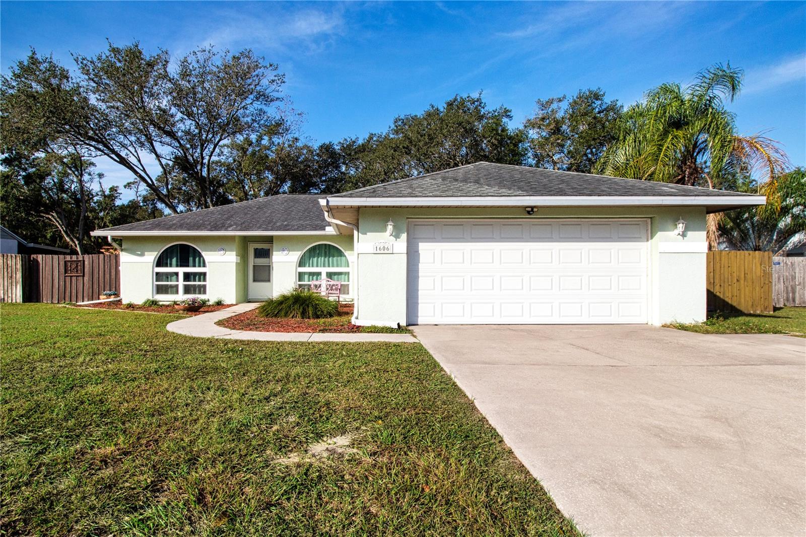 Welcome to 1606 Loghill Place in Brandon, FL — a beautifully maintained 3-bedroom, 2-bath home situated on an expansive 0.65-acre landscaped lot in the Lakeview Village community. Located in a no flood zone and set at a high elevation, this fully furnished, move-in-ready home offers comfort, space, and peace of mind with numerous recent upgrades.The kitchen features Corian countertops and a newer refrigerator (2023), opening to functional living and dining spaces ideal for everyday living and entertaining. Both bathrooms were upgraded in 2023, adding modern touches throughout. The home features tile and wood laminate flooring for easy maintenance and durability. Bedroom two includes a built-in queen-size Murphy bed, offering flexibility for guests or a home office.Major updates include a new roof (2018), A/C system with new air ducts (2018), and a water heater replaced in 2023. Enjoy tranquil pond views and the privacy of a fully fenced backyard, perfect for outdoor living, pets, or entertaining. The beautifully landscaped yard provides ample space to relax or expand. The Lakeview Village HOA is only $147 a year.Conveniently located just minutes from Brandon Town Center Mall, shopping, restaurants, entertainment, and major highways with easy access to Tampa and surrounding areas.Priced at $375,000 and offered fully furnished, this is a rare opportunity. Schedule your private showing today!