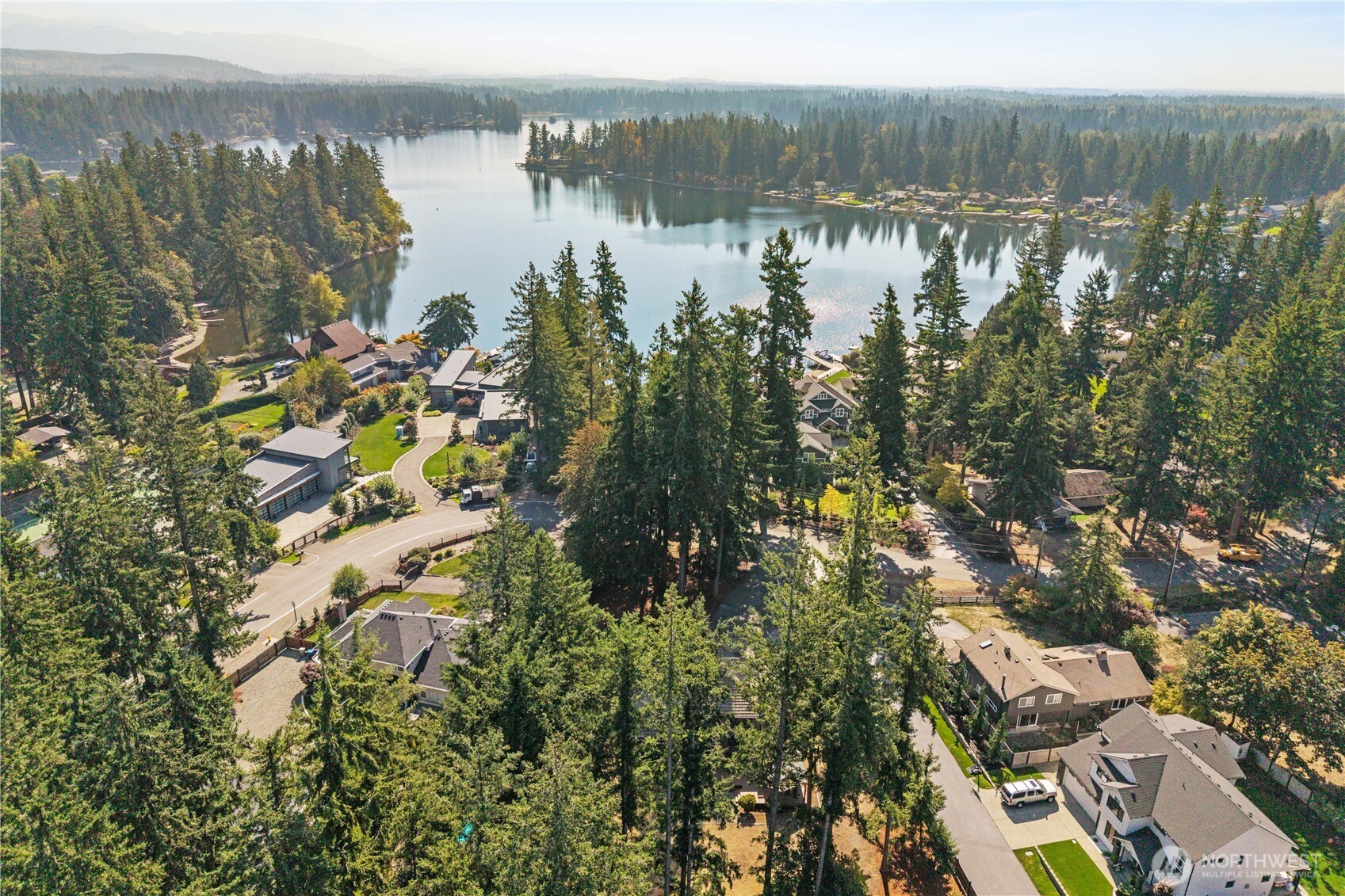 Gorgeous, newly remodeled 3-bed, 2.25-bath gem in Black Diamond just moments from Lake Sawyer! Nestled on over a half acre, this home provides the perfect blend of space, modern style, and serenity. Walk into the two story entryway and enjoy dual living spaces, complemented by a large kitchen w/ commercial range, new cabinets & countertops. The dining room and additional eating nook offer space for easy hosting, and a main floor office for work or study. The primary suite boasts a reimagined 5-piece en-suite w/walk-in closet, with 2 more bedrooms and refreshed 3/4 guest bath. Step outside to a sprawling back deck overlooking the expansive lawn, ideal for relaxing or hosting gatherings.