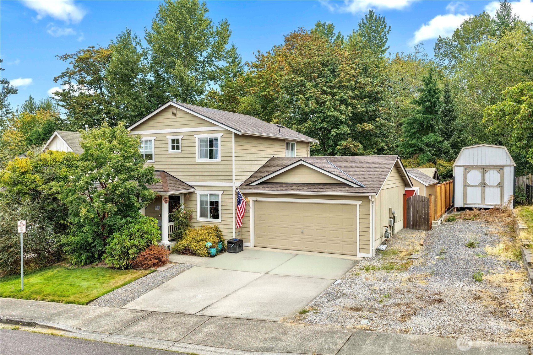 Welcome home to this 3-bedroom, 2.5-bath home with a comfortable layout and a backyard that backs to a greenbelt. The home has been thoughtfully updated with designer touches throughout, brand-new LVP flooring, new interior doors, and a space-efficient mudroom.  The kitchen features quartz countertops, freshly painted cabinets, and a new refrigerator. The laundry room includes extensive custom cabinetry and quartz countertops for added storage and workspace.  Additional updates include a newer roof, furnace, and central air conditioning.  The backyard offers a large Trex deck, two patios, including one covered patio, and a large storage shed. Mature landscaping and two plum trees add to the garden setting, while the greenbelt behind the property provides a natural backdrop.
