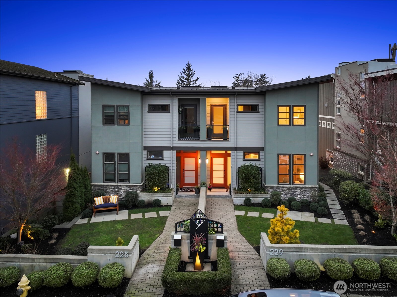 Welcome to Marina Vista, a sleek, custom townhome nestled in the heart of downtown Kirkland and just steps from Lake Washington and Marina Park. Modern, seamless aesthetic with elevated finishes and designer touches throughout. Floor-to-ceiling windows frame beautiful lake views, seamlessly blending the beauty of the outdoors with refined interior living. The open spacious floorplan is perfect for entertaining! Chef-inspired kitchen with lake views and high-end appliances. Upper level with light-filled landing with skylights, three bedrooms and two full baths. The primary suite serves as a private retreat, featuring a private deck with lake views and a luxurious 5-piece bath with tub and walk-in shower. The lower level offers exceptional flexibility and comfort, highlighted by a spacious recreation/family room featuring a built-in beverage refrigerator, wine cellar and half-bath - perfect for movie nights, game days, or creating a relaxed gathering space for friends. Move-in condition with new interior paint, plush new carpet & refinished hardwood floors. Elevator with access to all 3 floors provides great options for age-in-place and multi-generational living. Year-around outdoor deck with views! Premium location offers an unmatched lifestyle experience - stroll to downtown restaurants, shopping, summer concert series, bike the nearby Kirkland Corridor and enjoy swimming and paddleboarding at the nearby parks. An exceptional home for the discerning buyer!