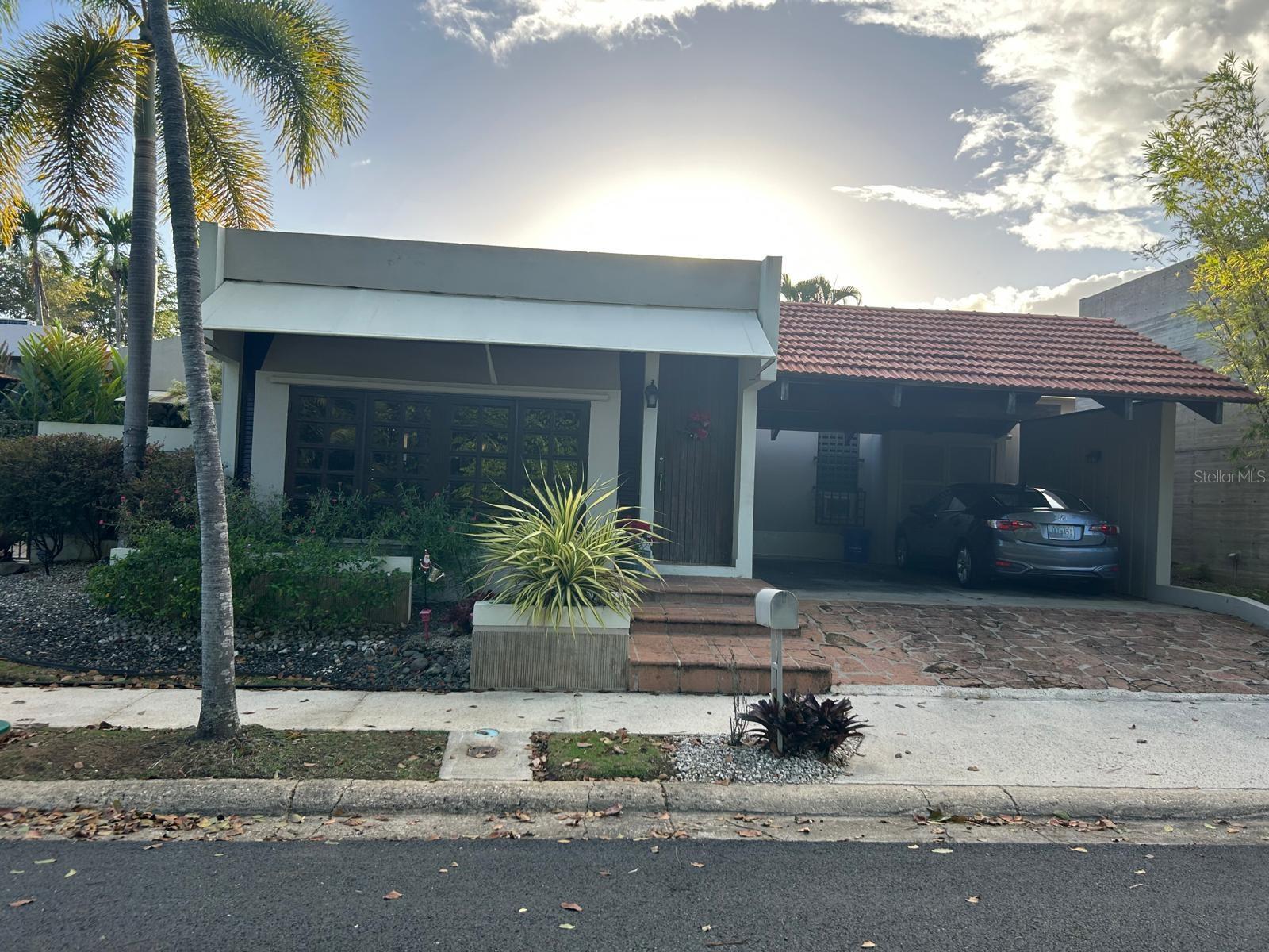 Exceptional single-level residence that combines comfort, privacy, and a privileged location in Urb. Mansiones de Villanova, San Juan. With 1,902 square feet of construction, this spacious property features four bedrooms, two remodeled bathrooms, a renovated kitchen, and a beautiful family room ideal for family enjoyment. The lot, measuring approximately 456.22 square meters, includes a spectacular swimming pool and a covered terrace perfect for family gatherings and entertainment activities.  Notable upgrades include a double garage, an 11-kW gas generator that powers the entire property, and access to a gated community with controlled entry.  Located on a quiet cul-de-sac with no front neighbors, this residence offers an exceptional level of privacy and tranquility. A true market gem, designed for those who value comfort, privacy, and quality of life.  Don’t miss the opportunity to own this magnificent property in one of the most exclusive and convenient communities in San Juan.