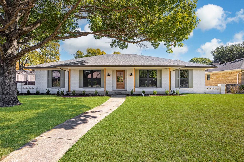 Nestled within the verdant canopy of Lochwood, this reimagined home (2025) marries organic sophistication with nuanced craftsmanship. Beyond the storybook curb appeal, a foyer of textured tones introduces a great room anchored by an elegant fireplace, seamlessly adjoining a dining nook and an exceptional chef’s kitchen.The kitchen centers around a deep-toned peninsula with seating for five—ideal for casual entertaining—while a six-burner gas stove and custom vent hood elevate the culinary experience. Refined cabinetry flows seamlessly into a butler’s pantry, complete with wine refrigerator and expansive storage and decorating possibilities. At the opposite side, the charming dining nook offers a third opportunity for gathering, while the private corridor behind it reveals an efficient laundry room, and a rear-facing 2-car garage that preserves graceful curb appeal. When it's time to unwind, the floor plan delivers. One wing houses a distinct fourth bedroom with private outdoor access—ideal as a guest room, office, or play room. Opposing this, a hall with decorative niche connects two secondary bedrooms with access to a stylish full bath. The primary suite offers a spa-level ensuite, featuring a soaking tub, frameless glass shower with two shower heads, and stunning modern fixtures.Beyond the interiors, a covered patio—perfect for morning coffee or an evening aperitif—opens to a lush, shaded backyard, offering a calm and timeless setting. Stroll along tree-lined streets toward the neighborhood playground and the creek, and experience the setting unique to Lochwood. Just a 10-15 minute drive from downtown Dallas and close to vibrant amenities, this beautiful home awaits.