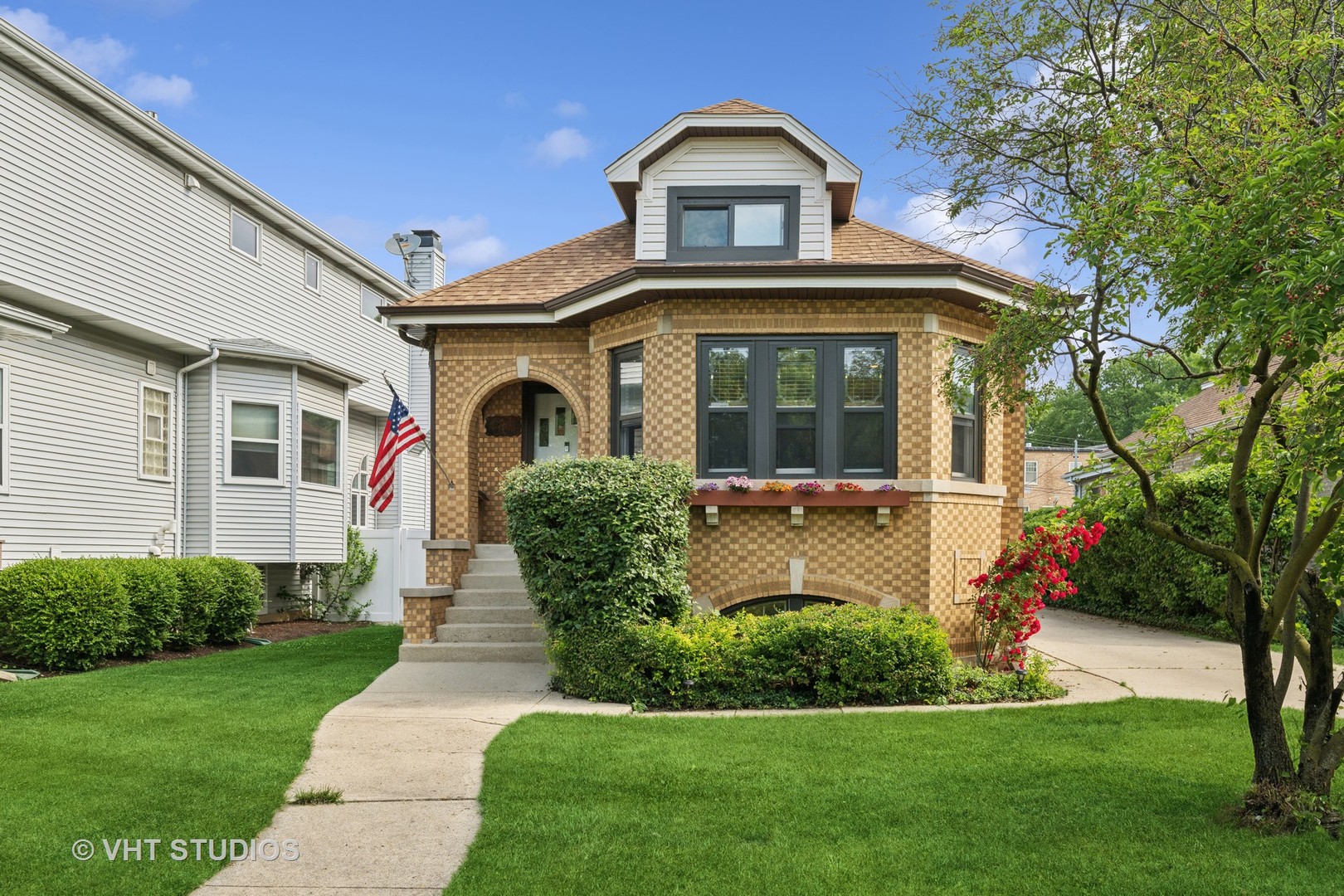 Charming Brick Bungalow in Historic Old Norwood Park. Nestled on the picturesque Hobart Street, just off the Circle in the heart of tree-lined, historic Old Norwood Park, this stunning brick bungalow sits on an exceptional oversized lot (49.9 x 204.5 x 38.5 x 205.5). Inside, you'll experience the perfect balance of classic charm and modern updates. Gorgeous stained-glass windows preserve the home's vintage appeal, while brand-new windows, storms, screens, exterior doors, an upgraded electrical panel, and two new AC units (installed as part of the 2023 O'Hare Window Replacement Program) ensure peace of mind and enhanced energy efficiency. The spacious, eat-in kitchen is designed for both everyday comfort and effortless entertaining, featuring rich oak cabinetry, granite countertops, a sleek stone and glass backsplash, and stainless steel appliances (updated five years ago). A brand-new double oven completes the space, while a large garden window and under-cabinet lighting add to its appeal. Original oak hardwood floors flow throughout the home, and the interior was freshly painted in 2023. The main level also includes a completely remodeled full bathroom with contemporary finishes. One of the home's standout features is the stunning third bedroom, which boasts a wood-burning fireplace with a gas starter, vaulted ceilings, dual skylights that flood the space with natural light, and a full closet. Additionally, a spacious, insulated walk-up attic presents endless possibilities to expand the home with more bedrooms, bathrooms, or living areas. The fully finished basement is an entertainer's dream, with a large rec room, custom 12-foot bar with a fridge and sink, a generous bedroom and full bathroom, a laundry area with a slop sink, and ample storage in crawl spaces and closets. With its separate exterior access, the basement is perfect for an in-law suite or multi-generational living.  Additional updates include a newer roof (5 years old), a 2 1/2-car heated garage with a workshop and attic storage, and a side driveway. The fully fenced yard features a two-tier deck and plenty of green space for outdoor enjoyment. Located just minutes from I-90, the Blue Line "L," Metra, and the highly rated Norwood Park Elementary School, this home offers an unbeatable location for both convenience and lifestyle.