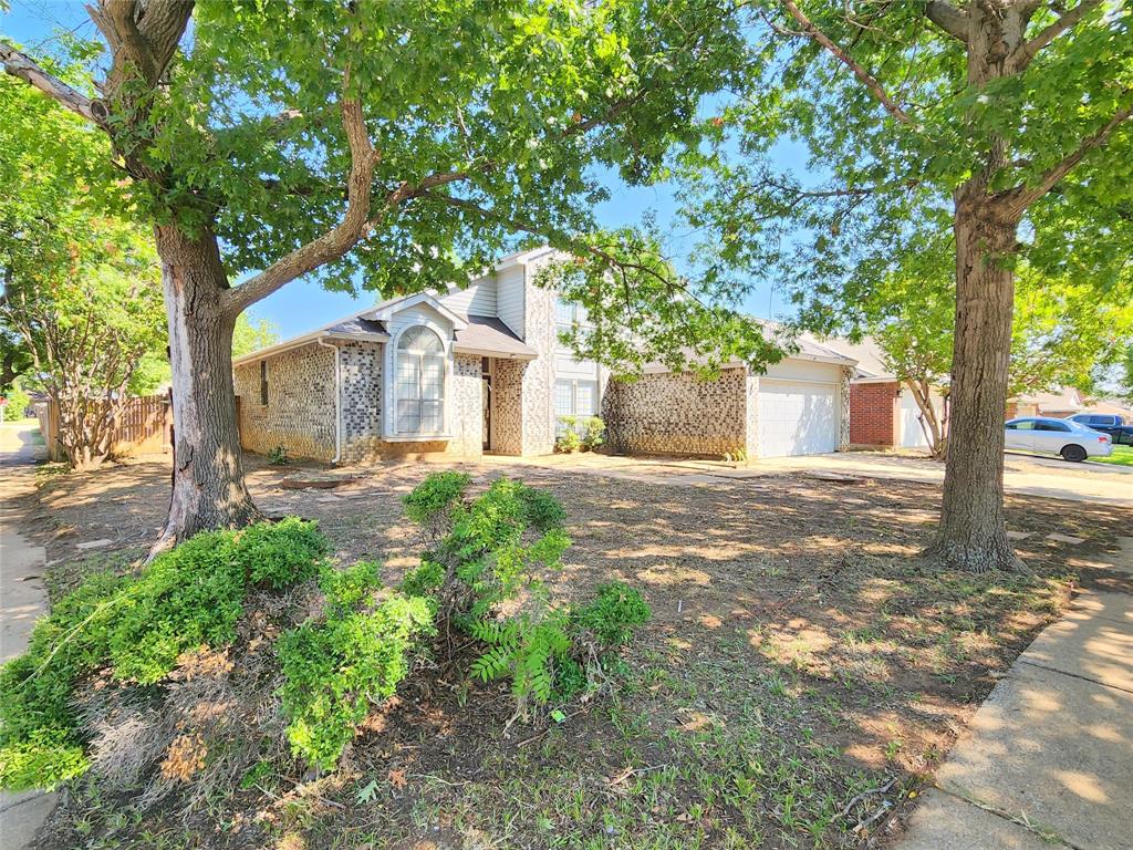 Priced to move quickly, this spacious home offers incredible potential with just a little TLC. Situated on a large corner lot shaded by mature trees, the property includes a fenced backyard and a two-car garage with opener. HVAC replaced with new R410A 4-ton system in 2020. Inside, you’ll find four bedrooms, two and a half bathrooms, and plenty of space for living and entertaining. The home is carpet-free, featuring ceramic tile, luxury vinyl plank flooring, and wood-tread stairs. As you enter, a private office with French doors sits to the right and a formal dining room to the left. Straight ahead, the living room impresses with soaring ceilings, abundant natural light, and a cozy wood-burning fireplace. The kitchen features granite countertops, an electric range, dishwasher, disposal, built-in microwave, water line for your refrigerator, a decent pantry and breakfast nook conveniently located just off the living area. The primary suite is on the main level and includes a full bathroom with dual sinks, shower, separate garden tub, and walk-in closet. Also downstairs are a half bath, laundry room, under-stairs storage and interior access to the front-facing garage. Upstairs, three additional bedrooms share a full bathroom with dual sinks and a combo tub-shower enclosure with sliding glass doors, providing ample space for family or guests. Located in the desirable Meadow Creek community, this home is close to everyday conveniences including Walmart, Albertsons, and a variety of shops and restaurants. Easy access to I-35W, I-20, and Chisholm Trail Parkway makes commuting simple, while nearby attractions like Hulen Mall, The Shops at Clearfork, downtown Fort Worth, and Dickies Arena are just minutes away. This property is being sold as-is and is ready for your personal touch. Foundation previously repaired in 2008 & 2023, no transferrable warranty available.