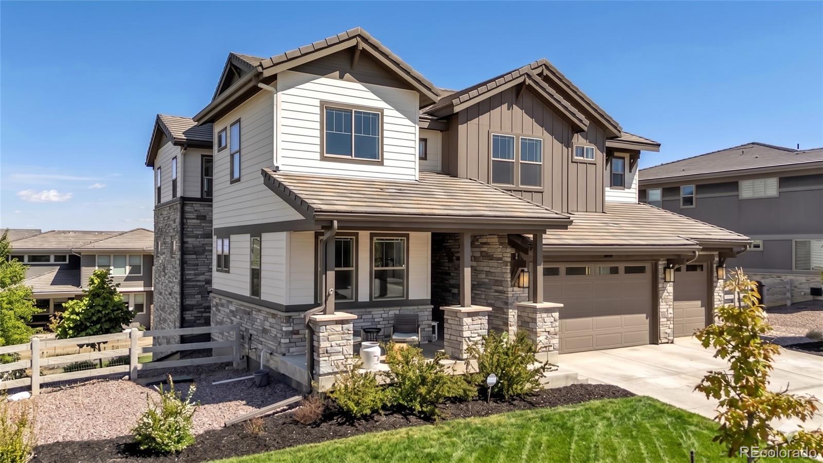 Welcome to Anthem Reserve! This expansive, light-filled home pairs sophisticated style with thoughtful design and a versatile layout in one of Broomfield’s most desirable communities. At the heart of the home is a well-appointed kitchen featuring a large island with built-in dining, premium appliances, and a custom wine room. The layout flows naturally into the family room with gas fireplace, creating an ideal space for everyday living and entertaining. An oversized covered patio extends the main living area outdoors and captures terrific Front Range views. Near the entry, a versatile front room works equally well as a formal dining room or sitting area, while the bright main floor office provides an ideal work-from-home setup. Upstairs, the layout is thoughtfully designed for privacy and quiet. The loft and bedrooms are well separated from the main living spaces, minimizing noise transfer from the kitchen and family room below. The primary suite features a perfectly-size luxury bath and oversized walk-in closet with direct access to the laundry room. An en-suite bedroom plus two additional bedrooms connected by a Jack-and-Jill bath complete the upper level. The finished walk-out basement expands the living options with a wet bar featuring a full-size refrigerator and dishwasher, ample recreation space, and a fifth bedroom with full bath for guests. A rare four-car tandem garage and wide driveway are integrated into one continuous garage bay configuration for exceptional functionality. Just inside, the oversized mudroom includes a beverage refrigerator, coat closet, cabinetry, and generous counter space creating the perfect landing zone for daily life. Enjoy Anthem’s outstanding amenities including a recreation center, pools, fitness facilities, parks, ponds, trails, and neighborhood schools just moments away. Convenient access to DIA, Boulder, plus nearby shopping, dining, and recreation.