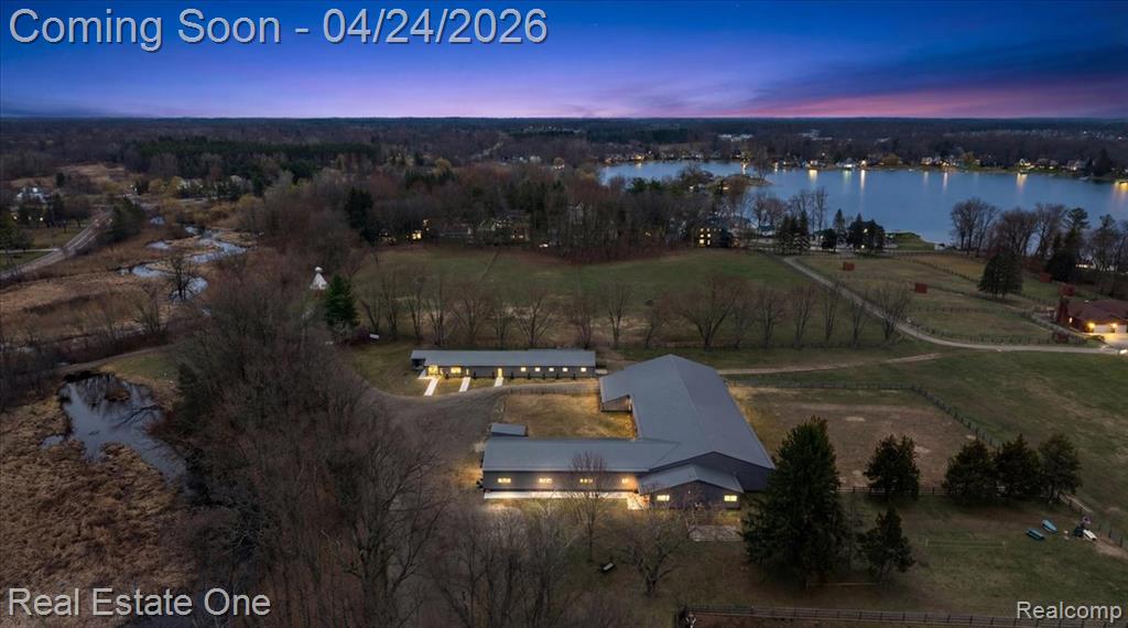 Imagine 110 extraordinary acres with three distinct residences, expansive barns, and picturesque trails weaving through mature woodlands. A rare offering that blends natural beauty with versatility, creating the perfect setting for a private estate, equestrian lifestyle, or legacy property.An extraordinary equestrian estate set in a breathtaking natural landscape. Cross the Huron River to reach your own private retreat, where over $1 million in upgrades have been completed within the last five years.The property is thoughtfully designed for both function and comfort, featuring a 60' x 140' indoor riding arena and a total of 22 spacious 10' x 12' stalls. The barn includes a well-appointed observation room with a full bath, along with an office, tack room, and dedicated kitchen area.Additional highlights include a custom greenhouse, a chicken coup, and raised garden beds, offering endless opportunities for hobby farming or sustainable living. Outdoors, you'll find a large riding arena, three expansive pastures, and all-new fencing throughout the property.The main residence overlooks the river, providing peaceful views and direct access for kayaking or canoeing. A beautifully finished 1,300-square-foot guest house includes a full kitchen, bath, beautiful screened porch with serene views of the surrounding pastures and river.  The third property features  a barndominum, 1,044 sq ft house, 3 stalls, office areas and huge 6+ car garage. This is a seperate parcel with 10 acres, polo field, and newly fenced pastures. The adjoining 70 acres or woods and wetlands affords private trails for your enjoyment.  All three parcels are included in this sale totaling 110 acres.  This property would make an ideal wellness retreat or sustainable living center. Ideally located near shopping and dining, this property offers the rare combination of convenience and complete seclusion—an exceptional place to call home. Please do not enter property without an appointment.