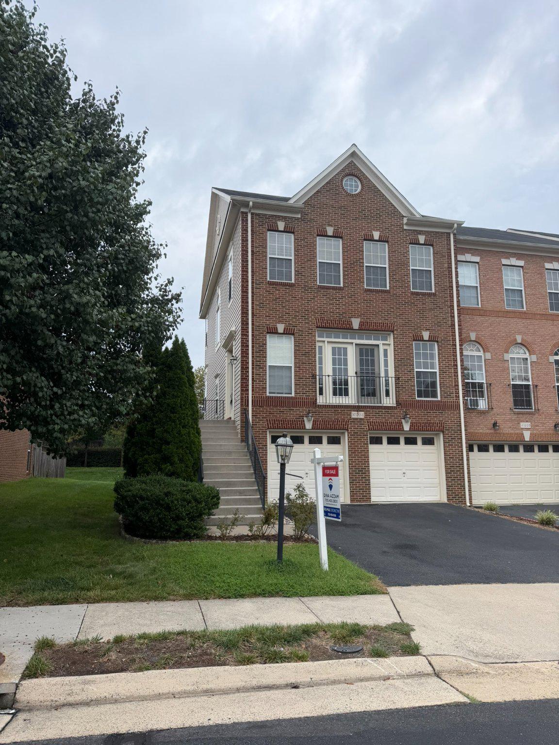 Open Sunday 2 to 4 pm, 8/23. Gorgeous end-unit townhome with windows on three sides and plenty of natural light. Very SUNNY and bright. This immaculate, well-maintained, spacious home offers 2,568 finished sq. ft., 3  bedrooms, 2 full and 2 half baths, and an expansive 2-car garage. Features include wood floors on the upper two levels, LVP in the finished lower level, a large kitchen with beautiful stainless steel appliances and gorgeous granite, recessed lighting throughout, fresh paint, AC replaced 2025, Hot water heater in 2021. The home fronts and backs to open space, with an unusually large, fully fenced private yard, plus PLENTY of guest parking right across. Located in sought-after Stone Ridge, with three pools, a fitness center, clubhouse, tennis and basketball courts, tot lots, an amphitheater, and walking trails. Move-in ready and shows extremely well.