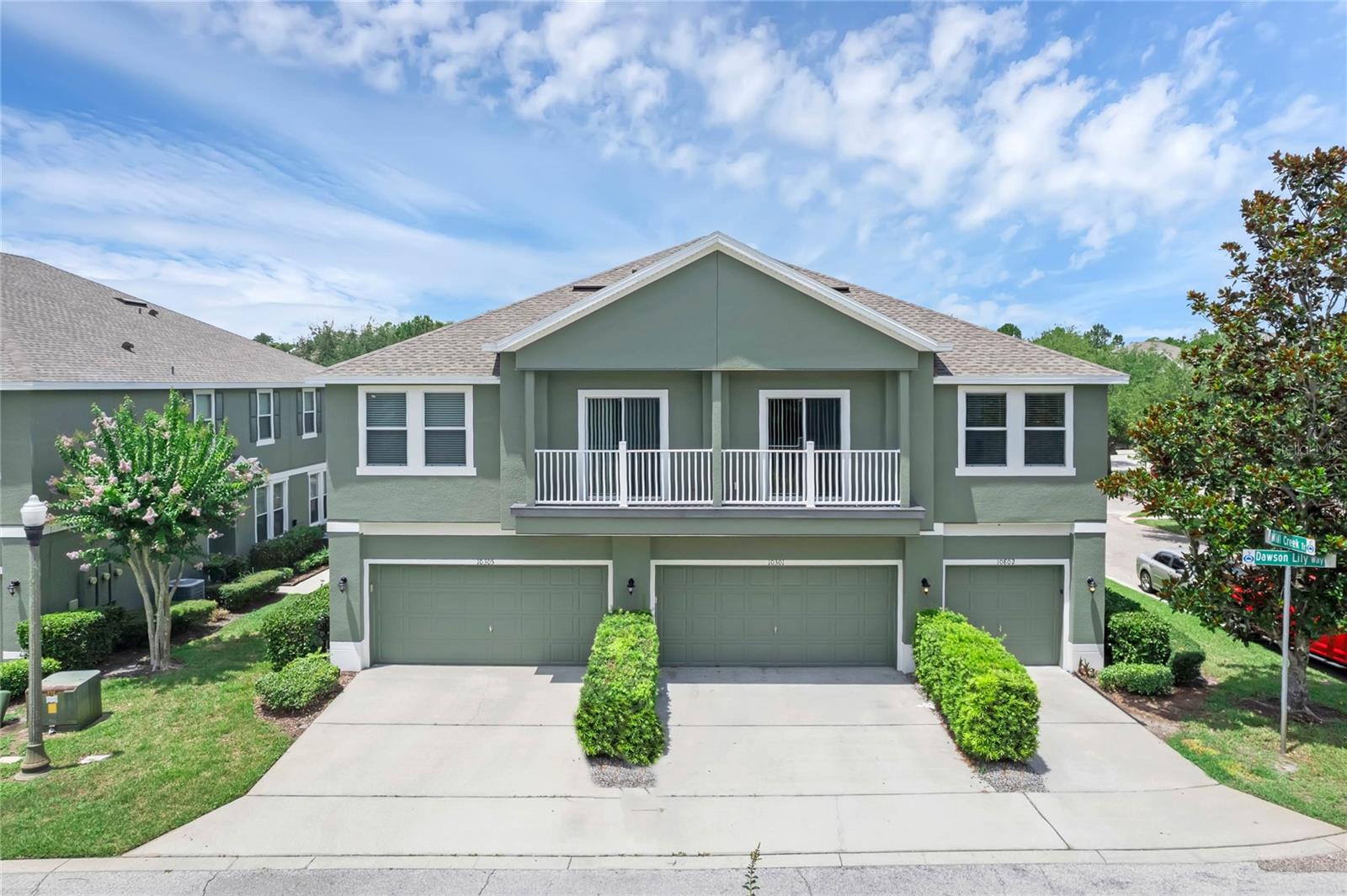 Under contract-accepting backup offers. Short Sale. Welcome home to your end-unit townhouse in East Park!This bright and inviting home features an open floor plan with a thoughtfully designed layout—offering a bedroom on each side of the spacious living and dining areas for added privacy. The large kitchen overlooks double sliding glass doors that lead to two private balconies, where you can relax and enjoy peaceful forest and tree views. With abundant windows throughout, natural light fills the space beautifully.The primary suite includes a private en-suite bath, creating a comfortable retreat. Additional highlights include a separate laundry room, one-car garage, and brand-new carpet for a fresh, move-in-ready feel.Enjoy the lifestyle that East Park offers, with scenic parks and trails surrounding East Lake. The community also features tennis courts and a playground, perfect for recreation and relaxation. Conveniently located near all that Lake Nona has to give, with a short drive to Orlando International Airport.Comfort, convenience, and natural beauty—this East Park townhouse has it all!