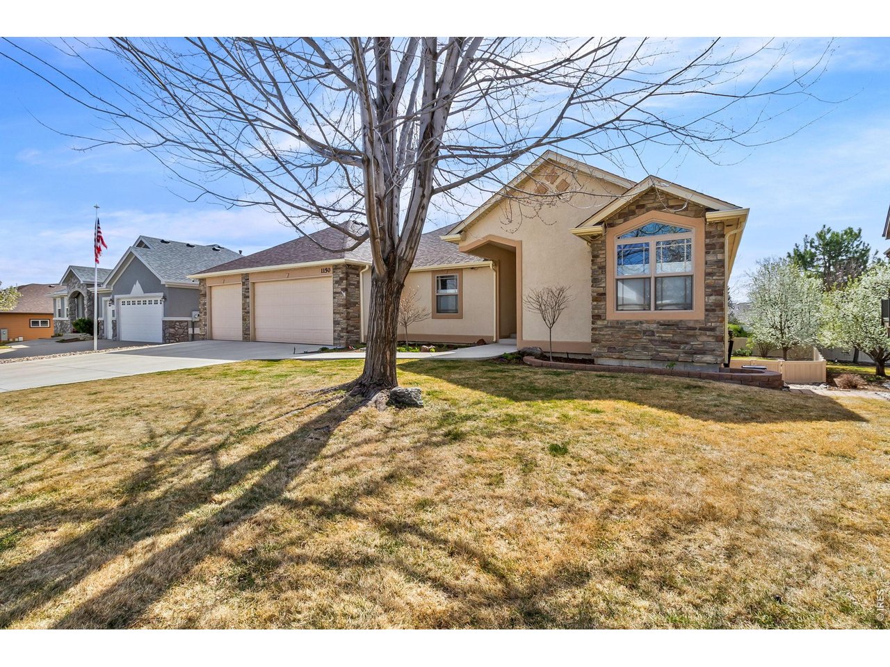 Impeccably maintained and thoughtfully updated, this 3-bedroom, 3-bath home in the desirable Alford Lake subdivision offers the perfect blend of comfort, quality, and efficiency. Featuring a durable stucco exterior and set on a large, beautifully landscaped lot, this home showcases exceptional pride of ownership from the moment you arrive. Inside, the home offers a warm and inviting layout with refinished hardwood floors and well-maintained finishes throughout. The kitchen is equipped with high-end appliances, including a GE Cafe induction double oven and dishwasher, GE microwave, and a Whirlpool 4-door refrigerator-ideal for both everyday living and entertaining. Hunter Douglas window coverings add style and function throughout. Major system updates provide peace of mind, including a Class 4 impact-resistant roof (2020), high-efficiency heat pump with A/C (2024), tankless water heater, radon mitigation system, and a QuietCool whole house fan for enhanced comfort and energy efficiency. A programmable hot water recirculation system adds everyday convenience. The walk-out basement expands your living space and offers flexibility for entertaining, guests, or recreation. The garage is a standout feature, complete with epoxy flooring, heating, and built-in cabinetry-perfect for storage, projects, or year-round use. Outdoor living is just as impressive, with a beautifully updated deck overlooking the spacious, lushly landscaped yard, creating a private and inviting setting. Don't miss the large, unfinished walk-out basement for future expansion. This is a rare opportunity to own a truly move-in-ready home in a sought-after Loveland neighborhood, where every detail has been carefully considered and meticulously maintained.