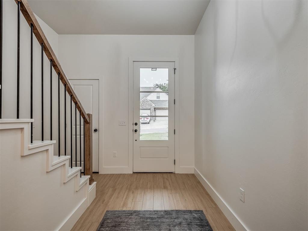 This beautiful traditional home offers 3 bedrooms, 3.5 baths, and a private study — thoughtfully designed for comfort and style. The open-concept living area features a stunning floor-to-ceiling tiled fireplace and a wet bar, perfect for entertaining. The chef’s kitchen boasts an expansive island, high-end finishes, and a generous walk-in pantry. The private primary suite offers a spa-like bath for ultimate relaxation. A secondary bedroom with ensuite bath is conveniently located on the main level, ideal for guests or multigenerational living. Enjoy the outdoors year-round on the covered patio, complete with an outdoor kitchen, beverage cooler, and grill. Situated on a desirable corner lot in a sought-after neighborhood, this home is just steps from the community park and grill station — and located in the highly regarded Edmond School District. Elegant, functional, and full of charm, 1533 Mason Lane perfectly blends comfort, quality, and location.