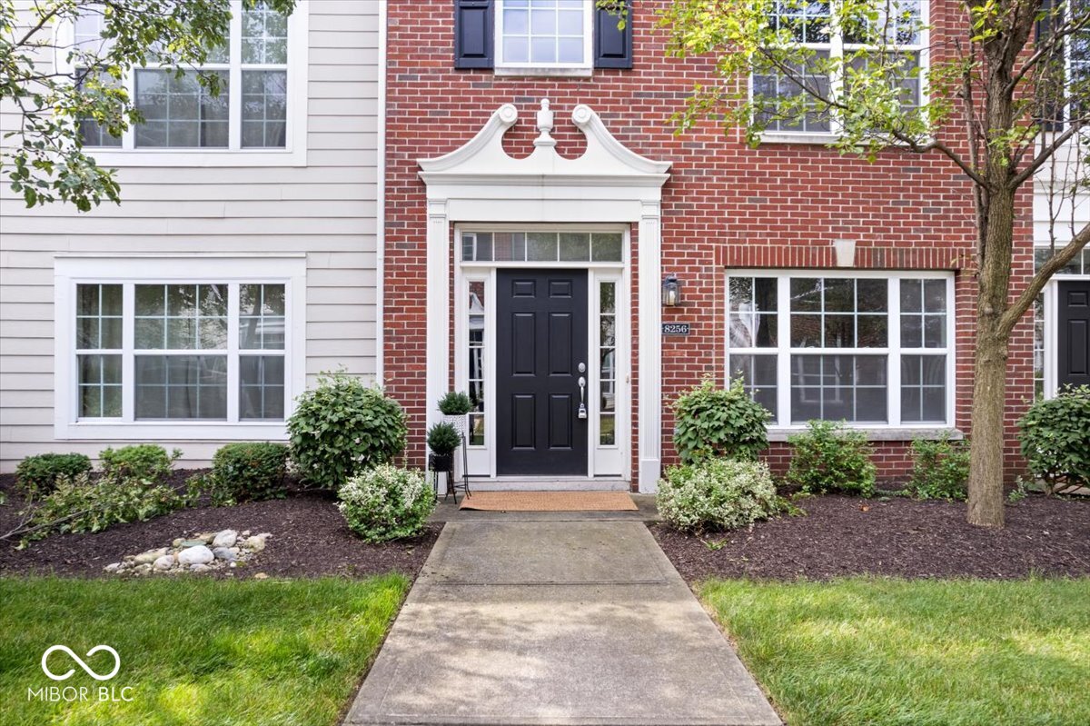 Elegant Townhome in the Heart of Downtown Fishers!    Discover this stunning 3-bedroom, 2.5-bath townhome nestled in the vibrant heart of downtown Fishers. This prime location offers the ultimate urban lifestyle, where you can walk to all the city's best amenities, including restaurants, shops, The Yard at Fishers District, and more. With easy access to I-69, commuting is a breeze.  Step inside to a beautifully designed interior featuring hardwood floors throughout the main level, bonus room, primary suite, and upper hallway. The spacious, open-concept kitchen is a chef's delight, boasting gleaming granite countertops, a large island, 42-inch cabinets, and a breakfast bar-perfect for casual dining or entertaining.  The expansive family room is the centerpiece of the home, offering a cozy fireplace and a balcony that extends your living space outdoors. The two-story foyer makes a grand first impression, leading to the lower-level bonus room. Flanked by elegant columns, this versatile space can serve as a sitting room, study, or home office-truly endless possibilities to fit your lifestyle.  Upstairs, the primary suite provides a serene retreat with ample space, while two additional bedrooms offer comfort and privacy. The home also features brand new carpet, all new wood blinds throughout and fresh paint adding a fresh and luxurious touch.  The convenience continues with a finished 2-car garage, providing both storage and parking. Whether you're looking to embrace the vibrant downtown Fishers community or enjoy the comfort and elegance of a beautifully maintained home, this townhome is the perfect choice. Live where you love-schedule your showing today!