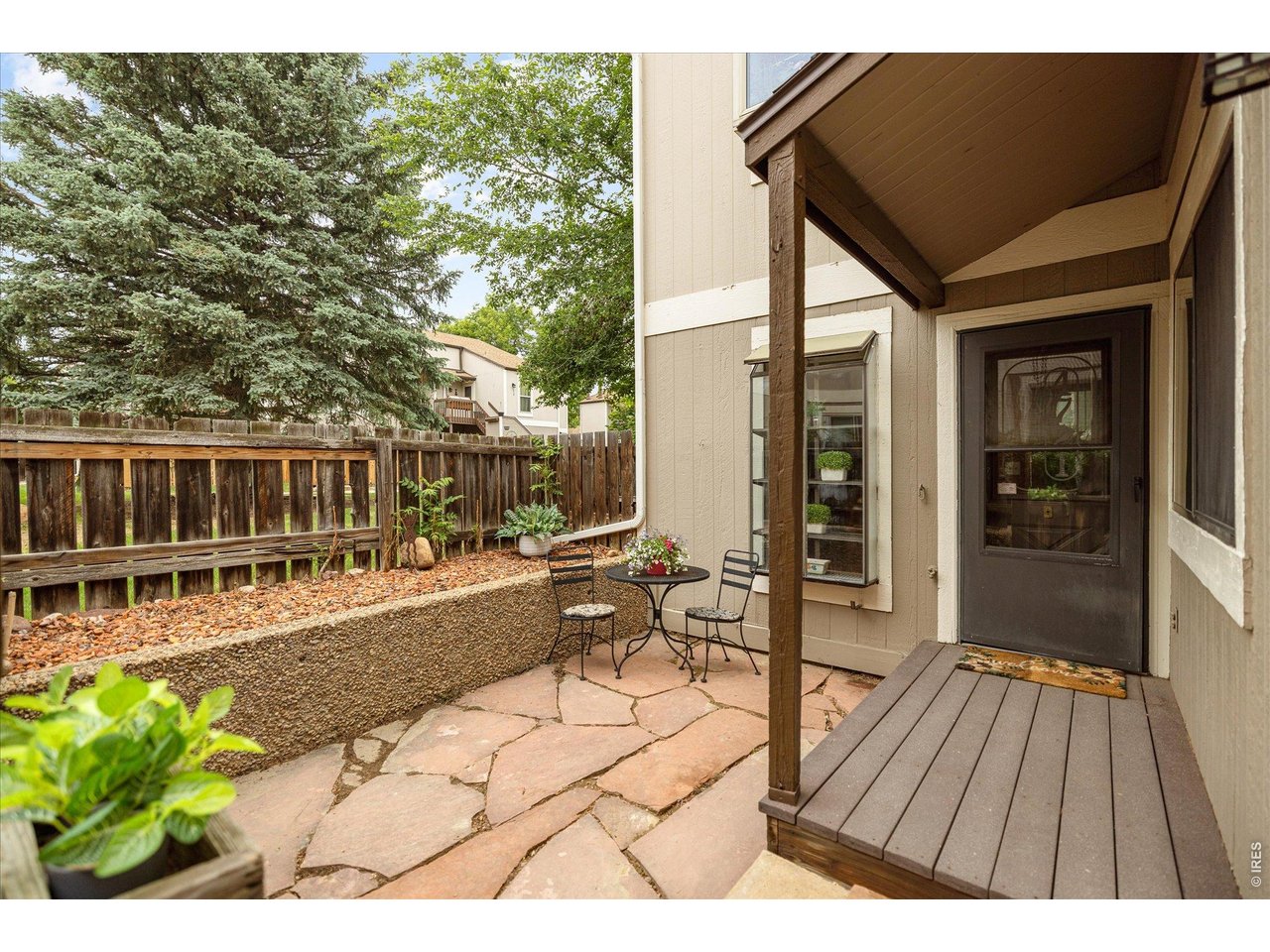 **Showing Start Saturday 5/30 by Appointment** Ideally situated in an end-unit location on the main level, this South Creek residence offers convenient one-level living in a coveted South Boulder setting. Southwest exposure enhances the inviting interiors, where plank style flooring and a cozy wood-burning stove create warmth and character throughout the main living area. The functional layout features a dining area flowing into a kitchen with generous cabinetry. The primary bedroom features a charming window seat, while the secondary bedroom offers space for guests or a home office. A private fenced patio presents the perfect setting for enjoying outdoor relaxation. Rare storage space is found in a detached one-car garage. Offered with renovation potential, this condo presents an exceptional opportunity in a prime location with proximity to trails, CU South Campus, Table Mesa Shopping Center, Tantra Park, RTD transit, US-36, Whole Foods, Southern Sun and Boxcar Coffee.