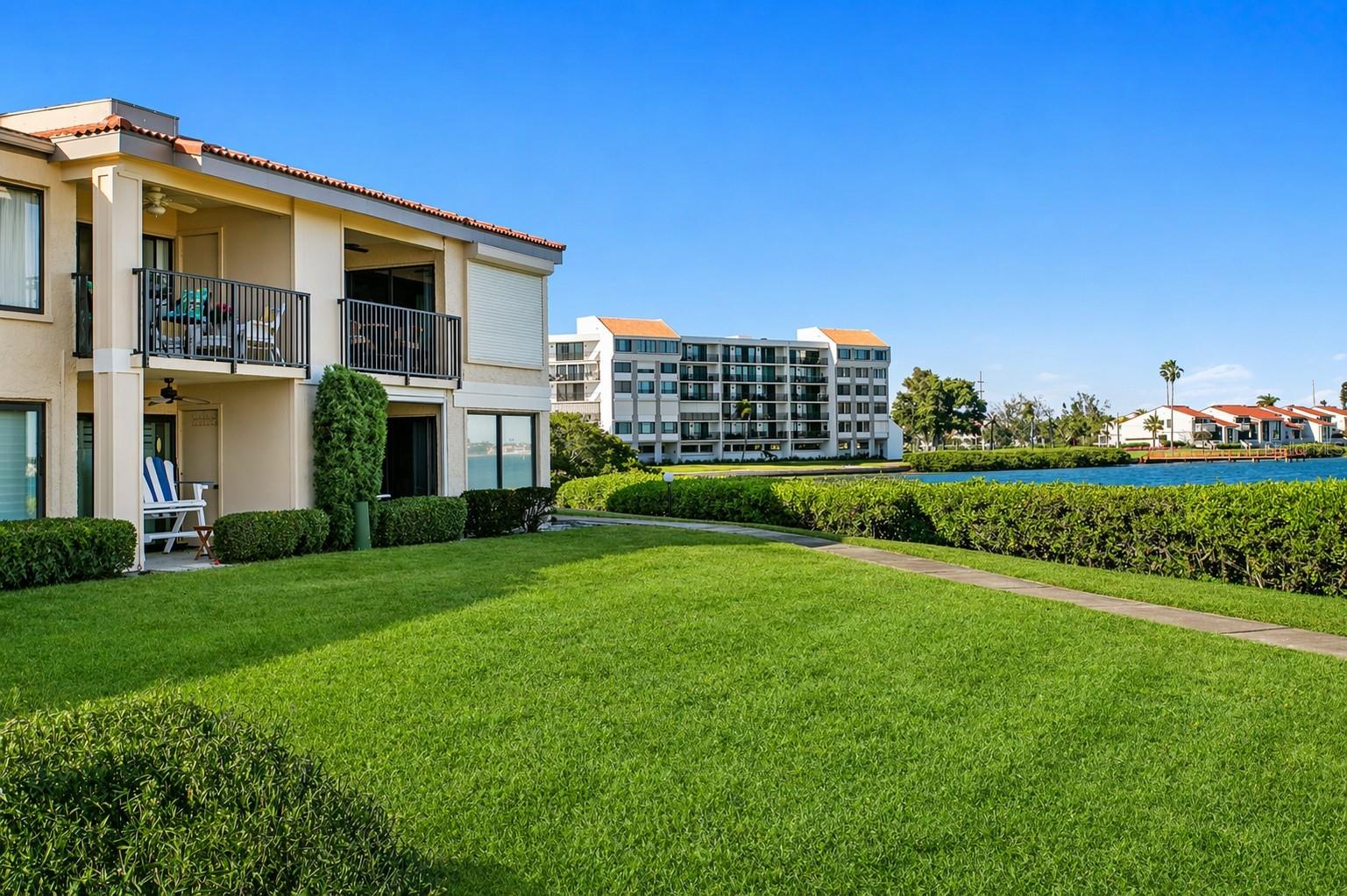 Experience expansive, open water views of Boca Ciega Bay from this beautifully updated second-floor residence in the highly desirable Palma Del Mar community on Isla Del Sol. With a view so wide it feels as though the bay becomes part of your living space, this waterfront condominium delivers a refined, effortless coastal lifestyle.The open-concept floor plan is designed to maximize both natural light and views, with sweeping water vistas extending across the living room, dining area, and into the primary suite. Large sliding glass doors and picture windows frame the waterfront backdrop, creating a seamless connection between indoor living and the natural beauty beyond.The kitchen is thoughtfully updated with newer appliances, including a recently installed refrigerator and disposal, offering both functionality and ease for everyday living and casual entertaining. The interior is finished in a relaxed coastal palette, complemented by durable vinyl plank flooring that enhances both style and practicality.The spacious primary suite serves as a private retreat, highlighted by direct bay views, a redesigned custom walk-in closet, and an updated spa-style bathroom. A split-bedroom layout provides privacy for guests, with a generously sized guest bedroom positioned adjacent to a second updated bath.Recent improvements provide meaningful value and peace of mind, including a new HVAC system (2026) and new water heater (2026), along with many updated coastal finishes throughout. The residence is offered fully furnished, creating a true move-in-ready or lock-and-leave opportunity.Step outside to your private veranda with new gemstone finishes - overlooking the bay and the waterfront pool and spa—an ideal setting for morning coffee, evening relaxation, and year-round enjoyment of Florida’s coastal climate. A covered parking space and private storage room located just steps from the front door add everyday convenience.Palma Del Mar has recently undergone community improvements and offers a resort-style setting with amenities that include a heated waterfront pool and spa, fishing pier, kayak storage, and community gathering spaces, all set within beautifully maintained grounds. Optional membership opportunities are available nearby at the Isla Del Sol Yacht & Country Club for golf, tennis, and social activities.Ideally located, you are just minutes from the award-winning beaches of Fort De Soto and St. Pete Beach, approximately 15 minutes to downtown St. Petersburg, with its museums, restaurants and parks and with convenient access to I-275 and Tampa International Airport.Whether used as a primary residence, seasonal retreat, or income-producing rental property, this residence offers a compelling combination of open water views, thoughtful updates, turnkey convenience, and exceptional location.