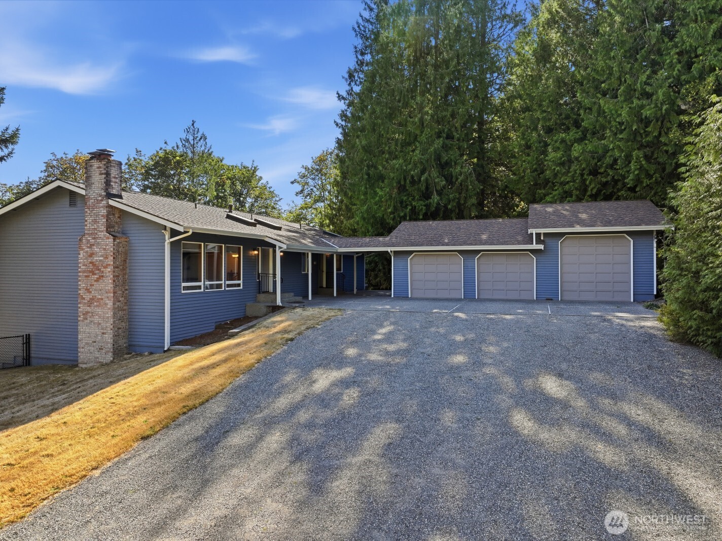 True Pacific Northwest living on nearly 5 private acres! Tucked among the trees, this custom-built, original-owner home offers incredible space, privacy and versatility just 30 minutes from Seattle. The 4,140 sq ft home features 4+ oversized bedrooms, 2.5 baths, a formal living room, and an inviting kitchen and family room designed for gathering and entertaining. French doors open to a spacious entertainer’s deck, while three fireplaces add warmth and character throughout. The expansive finished basement offers endless possibilities for recreation, hobbies, guests or multigenerational living, with a wet bar that could be converted to a second kitchen. A large laundry room on the main level includes a sink and drying racks.       Enjoy year-round comfort with a heat pump and AC, plus a 50-year roof installed just 5 years ago and upgraded insulation designed to improve energy efficiency. Outside, enjoy a large Trex deck with gas BBQ hookup, fully fenced grassy area and abundant parking.       The 1,200 sq ft, fully insulated and heated 3-bay garage/shop is a standout, offering RV parking, extensive storage shelving, workbenches, approximately 20 outlets and an air compressor. Well pump replaced in 2025, along with a whole-house filtration system. Central vacuum adds everyday convenience.       A rare opportunity to own a substantial custom home surrounded by nature—with room for everyone, room for everything, and the privacy of nearly 5 acres.