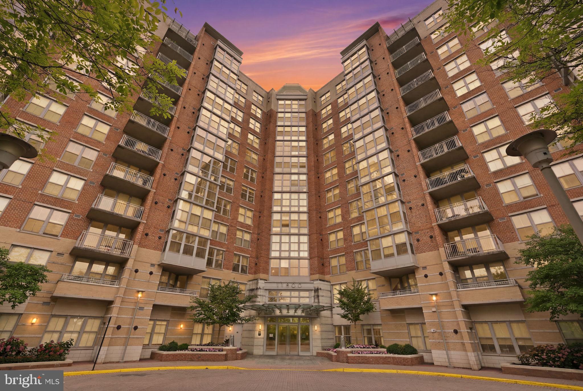 Experience elevated condominium living in the heart of Reston in this rare three-bedroom, two full-bath residence at Carlton House. Two private balconies showcase sweeping panoramic views, while floor-to-ceiling windows flood the home with natural light, creating a bright and inviting atmosphere throughout. The open-concept layout offers the perfect blend of comfort and functionality for both everyday living and entertaining.The thoughtfully designed floor plan features two spacious primary suites, each with a walk-in closet, plus a versatile third bedroom ideal for guests, a home office, or additional living space. A full-size washer and dryer, two side-by-side reserved garage parking spaces, and a private storage unit add everyday convenience.Perfectly positioned directly across from Reston Town Center and just minutes from Reston Station, you'll enjoy easy access to premier shopping, dining, entertainment, and the Washington & Old Dominion Railroad Regional Park Trail for walking, running, and cycling.Residents of Carlton House enjoy an exceptional collection of resort-style amenities, including a rooftop pool and sun terrace with grilling stations, fitness center, yoga studio, club room, theater, business center, billiards room, and full concierge service. Combining spectacular views, light-filled living spaces, outstanding amenities, and an unbeatable location, this home offers the very best of Reston living.