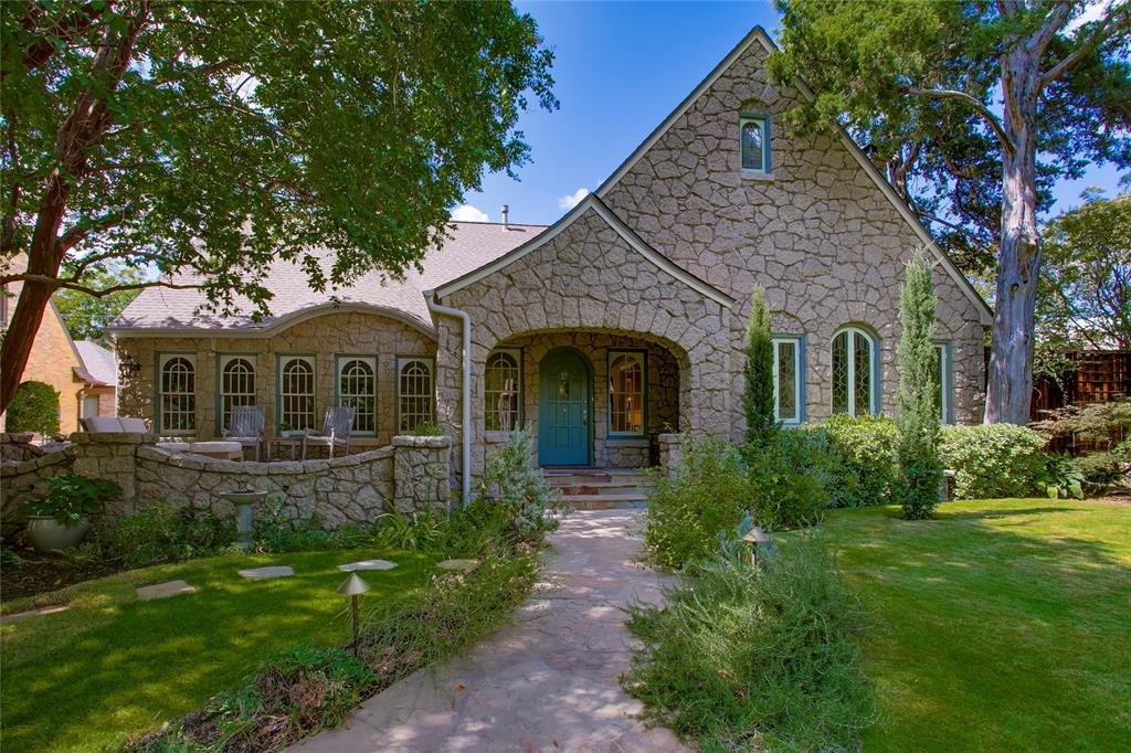 Welcome to 4119 Rock Creek Drive, an extraordinarily renovated and updated classic estate situated on a premier, tree-lined street in one of Dallas’ most coveted neighborhoods. Blending elegance with luxury, this magnificent residence delivers exceptional curb appeal, refined finishes, and effortless functionality for both entertaining and serene daily living. Step onto the stone patio and into the light-filled living spaces anchored by high ceilings, rich hardwood floors, intricate architectural millwork, and expansive windows that frame serene outdoor views. Completely renovated in 2020-2021, the thoughtfully designed layout flows from the formal living area with stained glass windows past the intimate dining area into the chef's kitchen. Equipped with Wolf & Sub Zero appliances, custom cabinetry, a large center island, stone countertops, and tons of natural light, the space is a delight. Off the kitchen overlooking the rear yard is a breakfast nook featuring floor to ceiling windows that also opens to the family room. The first floor bedroom is currently used as a game room and is located across the hall from a full bath featuring period tiles and accents. Step upstairs to the light filled hallway and library nook with built-in book cases and desk in addition to 2 bedroom suites. The primary suite is a sanctuary, featuring a spa-inspired bath with a dual vanities, oversized walk-in shower and a custom walk-in closet. Outdoors, experience a private backyard oasis. The landscaped grounds showcase a stunning pool and lounge area accompanied by a custom water feature, turf grass, open patio spaces and a landscaped side yard with mature shade trees. Complete with a detached 2-car garage and ample storage, this property delivers refined living at every turn. Located moments from the Katy Trail, premier dining and all that Uptown-Turtle Creek have to offer, 4119 Rock Creek Drive is a rare opportunity to own a practically new home in wrapped in a historic Tudor shell.