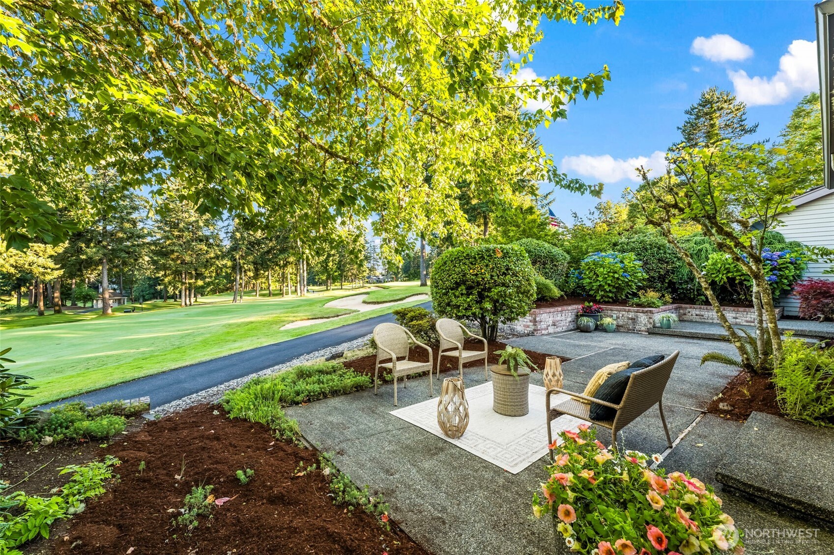 One of just five coveted Clubhomes along Canterwood’s 18th Fairway, this rare offering is all about ease, elegance, and front-row golf course living. Southeast-facing with loads of sun all day and bird's eye views of the action —mere steps from the clubhouse, pool, and pickleball courts.  The single-level layout is smart and stylish, with skylights and vaulted ceilings in the great room and kitchen, a spacious formal dining room, and three ensuite bedrooms, each with private access to a patio or garden courtyard.  Plenty of space to relax and spread out both inside and out.  With maintenance provided, whether you're downsizing to the forever home, snowbirding, or simply craving a lock-and-leave lifestyle, this home checks every box!