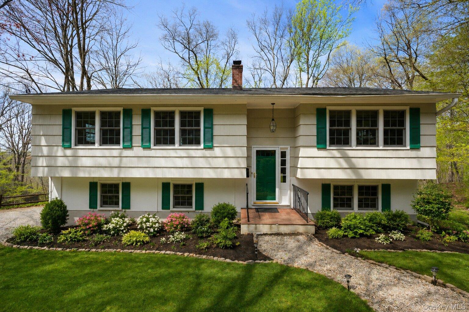 Well-maintained home in the sought after Katonah Ridge neighborhood. The main level features a spacious living room and dining room with sliding glass doors that open to a large private deck with beautiful vista views. The eat-in kitchen, three bedrooms, and full hall bath, with direct access from the primary bedroom, complete the main floor, along with hardwood floors throughout. The lower level offers a family room with a brick fireplace, a den or office that can easily serve as a private guest space, a laundry area, and a two car garage. Set on 2.3 acres, the property offers a large, private backyard and a peaceful setting. Conveniently located close to the Katonah train station, village shops, and dining, with easy access to Metro North, I-684, and the Saw Mill Parkway for a seamless NYC commute. Located in the top rated Katonah Lewisboro School District. Recent updates include a new roof and windows (2023), exterior painting (2023), and a new above ground Roth oil tank (2026). Offered for the first time in 60 years by the original owners.