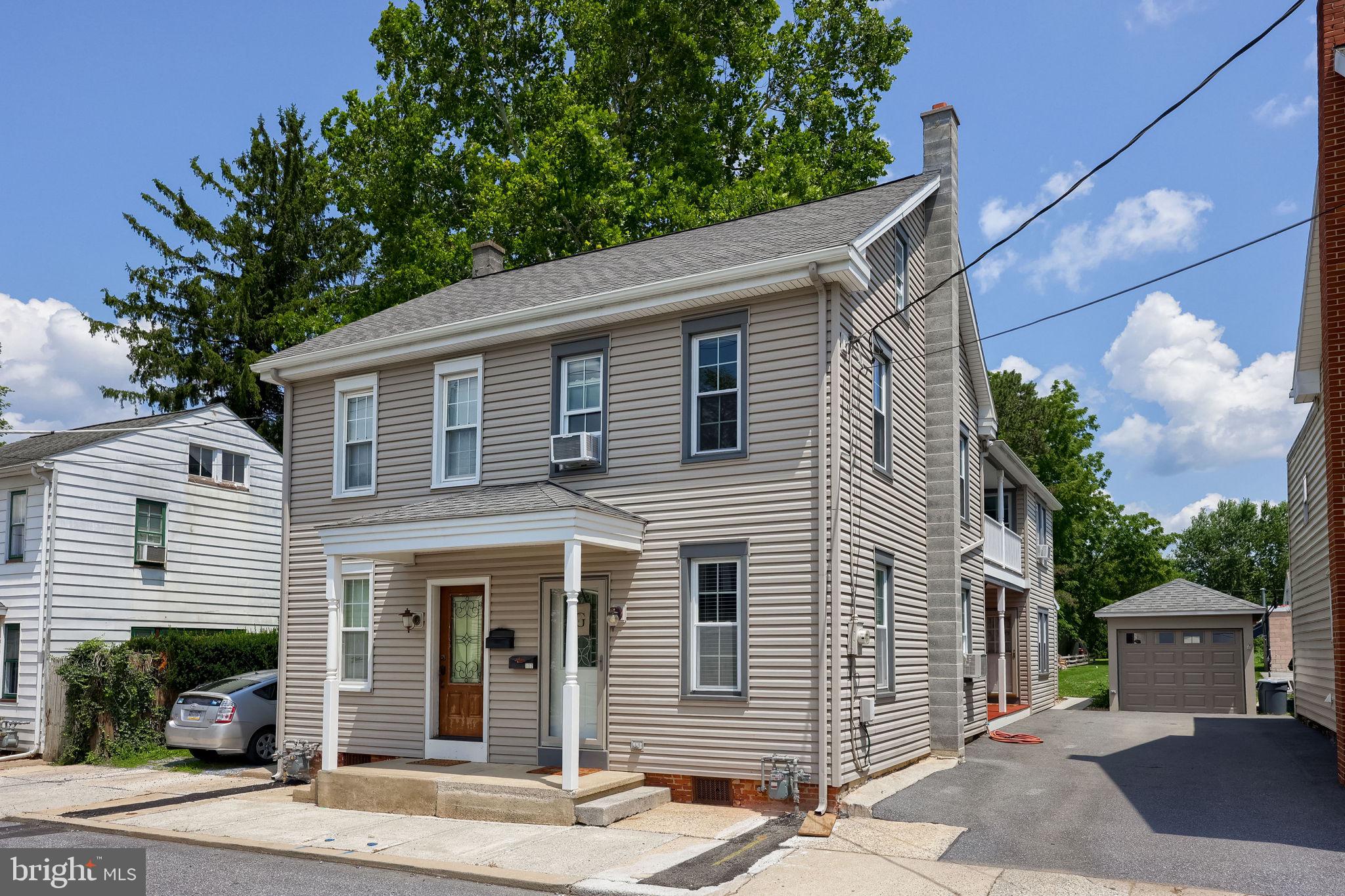 Well maintained home on a quiet street on the north end of Manheim Borough.  A welcoming layout and solid updates make this one easy to step into. The first floor offers a spacious kitchen with new countertops, a dining room and a living room. You’ll also find a full bath and convenient laundry hookups on this level. Upstairs features three bedrooms and a second full bath (walkthru bedroom for the 2 smaller bedrooms) and a walk-up attic provides excellent storage or future living space potential. The deep lot extends over 260 feet and includes two one-car garages, off-street parking, and additional rear access from Hart Street—offering flexibility. Recent updates include a new electrical panel and wiring. Replacement windows and an economical gas boiler add to the home’s overall comfort and efficiency.  A great opportunity in a convenient location—schedule your showing today.