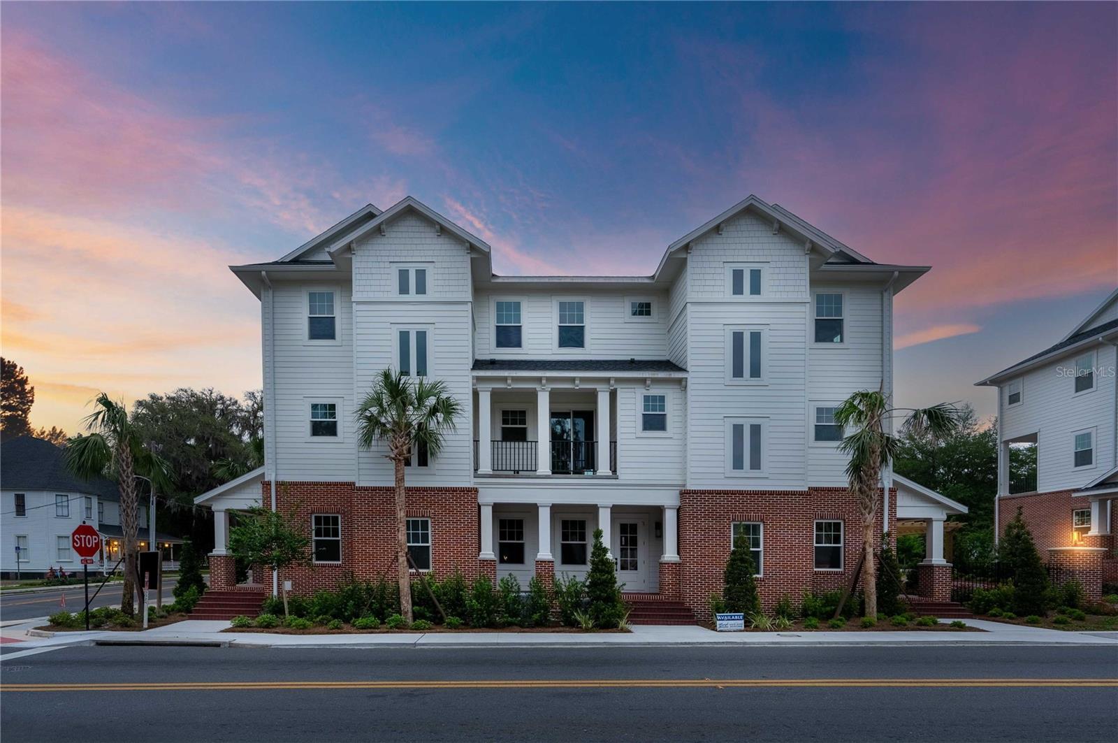 Experience vibrant downtown living in this brand-new, beautifully constructed townhome located just steps from Ocala's historic square, boutique shopping, and top-rated restaurants. This 3-bedroom, 3.5-bathroom residence offers the perfect blend of modern style, comfort, and convenience.

Step inside to an open-concept living, dining, and kitchen space adorned with custom modern finishes, sleek cabinetry, and designer lighting. The gourmet kitchen is ideal for entertaining, flowing seamlessly into the spacious living area and out to a private balcony with stunning views of downtown. Each of the three levels has been thoughtfully designed, featuring a luxurious primary suite complete with a spa-inspired bathroom and an oversized walk-in closet. Two additional en-suite bedrooms provide comfort and privacy for guests or family members.
Enjoy the convenience of a 2-car garage, low-maintenance living with HOA-managed landscaping, and the security of a gated community. Relax with neighbors at the community’s gas firepit or take a short stroll to downtown Ocala. This is the ideal home for those seeking upscale, walkable city living with the peace of mind that comes with new construction.