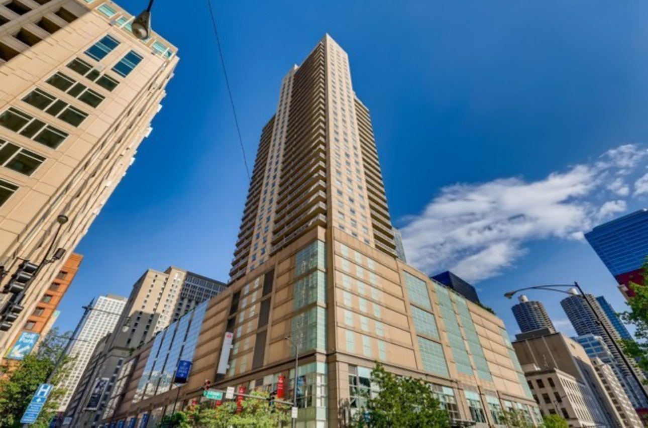 Spacious 1BD/1BA in the iconic Grand Plaza, right in the heart of River North! Features include hardwood floors, granite countertops, SS appliances, in-unit W/D, and a private balcony with city views. Full-amenity building with rooftop pool, gym, track, basketball court, dog run, sauna, fire pit, grills, library, and more! Investor-friendly with no rental cap (30-day min). HOA has $1.8M in reserves. Steps to top dining, nightlife, CTA/Metra, and 90/94. City living at its finest!