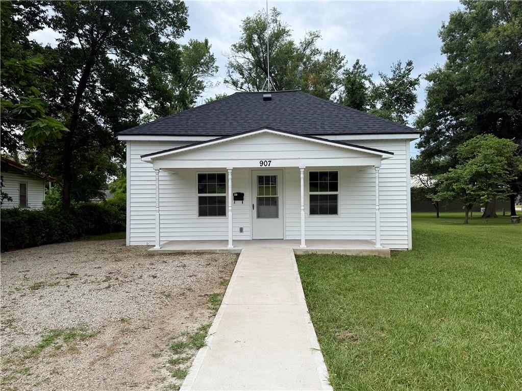 Move-in ready and packed with updates, this beautifully refreshed 2-bedroom, 1-bath home offers 858 square feet of single-level living in Rich Hill, Missouri. Recent major improvements include a brand-new roof and new central heating and air conditioning system, giving buyers added peace of mind for years to come.Inside, you'll find an inviting open-concept living room and kitchen featuring luxury vinyl plank flooring throughout, abundant natural light, and a timeless gray-and-white color palette that complements any style of décor. The kitchen is the heart of the home with crisp white cabinetry, custom concrete countertops, appliances that are included, and an open layout designed for everyday living and entertaining.Thoughtfully updated throughout, this home features updated plumbing, electrical, lighting, vinyl siding, and a beautifully remodeled bathroom. With so many major improvements already completed, all that's left to do is move in and make it your own.Enjoy your morning coffee on the covered front porch while appreciating the home's low-maintenance exterior. Conveniently located in Rich Hill with quick access to I-49, you'll enjoy easy access to schools, shopping, dining, and nearby amenities while still experiencing the charm of small-town living.Whether you're searching for a first home, looking to downsize, or adding a turnkey investment property to your portfolio, this updated Rich Hill home offers the modern finishes, major system updates, and convenience today's buyers are looking for.