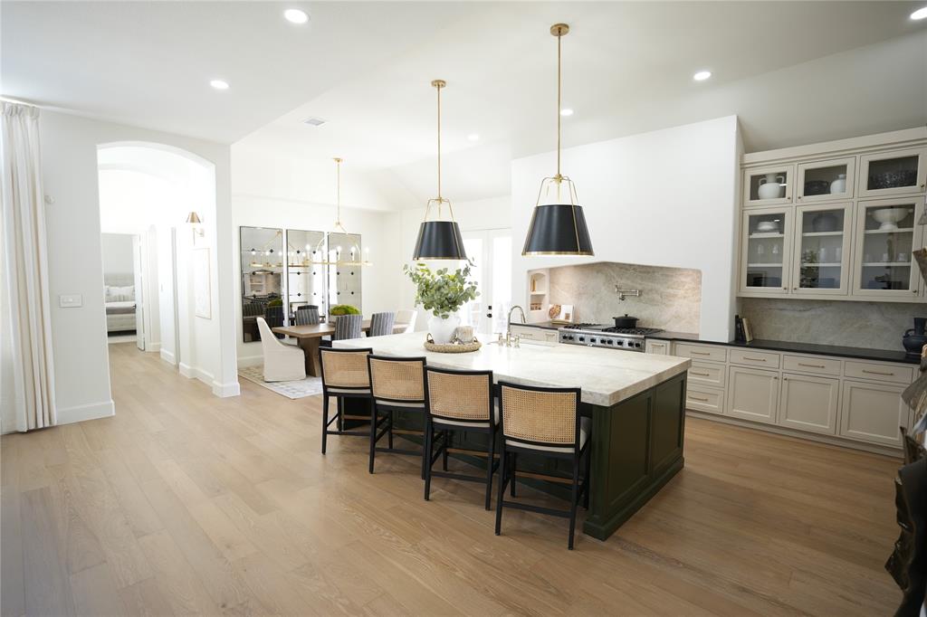 Step into a world of unpaired sophistication with this meticulously crafted home, where refined luxury living is thoughtfully designed to elevate your lifestyle in the Castle Hills community. The entrance welcomes you into a living space bathed in natural light, showcasing craftsmanship, timeless elegance, and state of the art amenities. Every detail of this stunning home has been curated with precision, from the spacious, open-concept layout to the high end finishes that adorn each room. At the heart of the home, a chef’s dream kitchen awaits—featuring a 10-foot Taj Mahal quartzite island, Viking 48-inch professional range, and a 30-inch column refrigerator and matching freezer. Whether you're preparing a quiet meal or entertaining a crowd, this space blends function with refined style. Upstairs and in all bedrooms, brand-new carpet adds comfort underfoot, while generous room sizes offer flexibility for family living or guests. Step outside to enjoy the expansive backyard oasis, complete with a fully equipped outdoor kitchen and sparkling pool—perfect for year-round entertaining. You won’t find another home like this in the neighborhood. From its thoughtfully curated design to the high-end finishes and custom features throughout, this property stands in a class of its own. A unique opportunity for the discerning buyer seeking something exceptional.