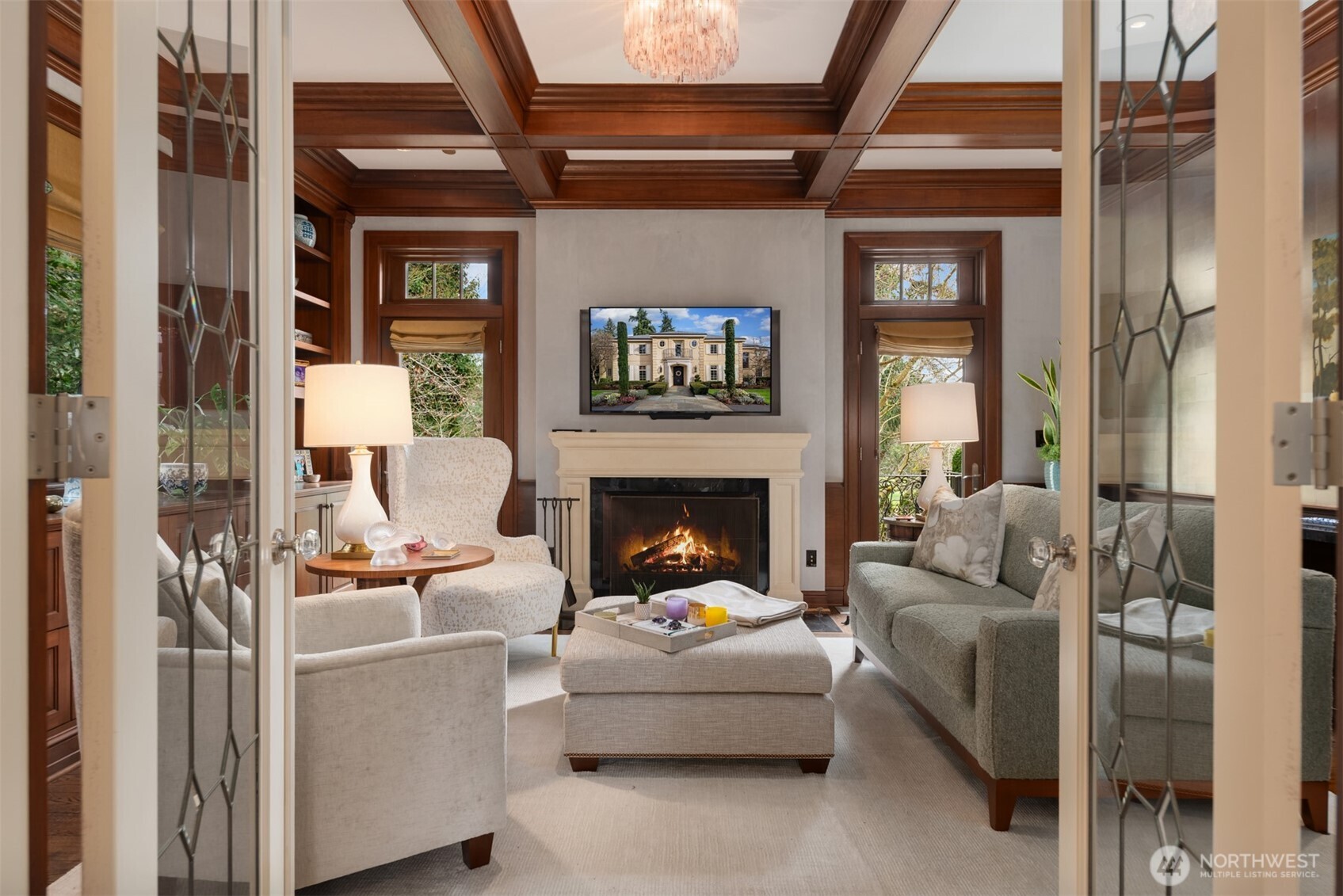 Beautiful library or sitting room with fireplace and custom millwork.