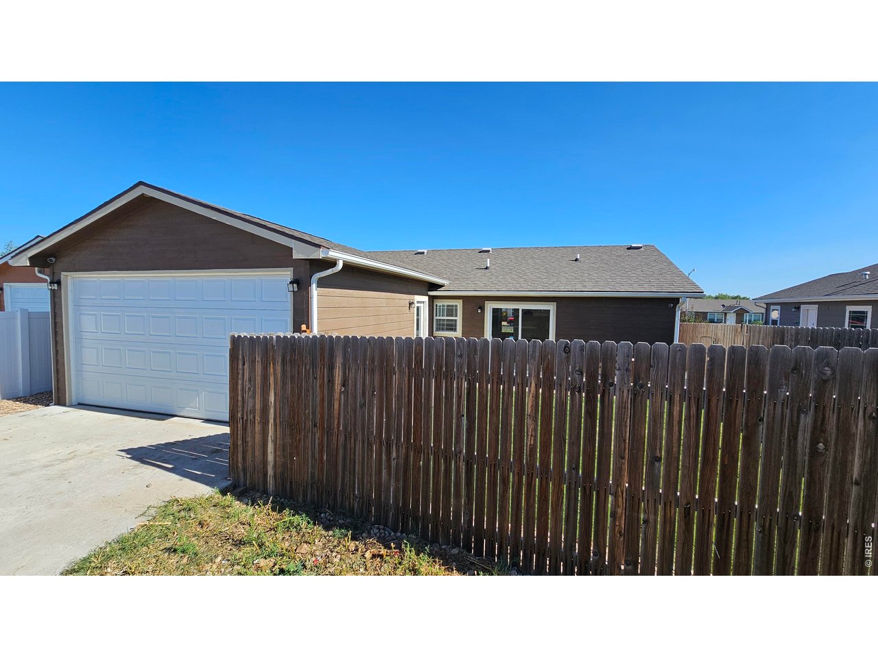 Easy. Comfortable. Updated. This ranch home features all footage on the main level, built in 2022, traditional floor plan, this property is sure to please! Enclosed wood privacy fence back yard also has a concrete pad & alley access for the attached garage. The patio doors invite you into the eat-in kitchen with stainless appliances. New interior paint, hardware, & lighting provide tasteful flair making it unique to you! Covered front porch with new sod in front & back yard is ready for you to move in & enjoy! Welcome home!
