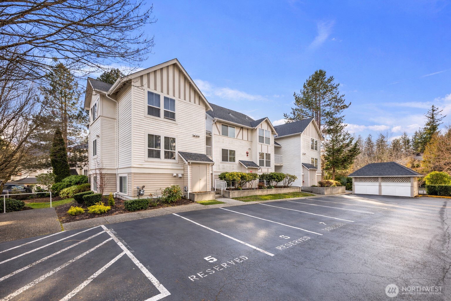 Welcome to Klahanie, a vibrant community offering parks, heated pools, tennis and sport courts, and scenic walking trails in a safe and welcoming setting, just moments from shopping, dining, and easy access to I-90. This 2-bedroom condo features an open-concept layout with new paint, and flooring throughout the living and dining areas, plus a cozy gas fireplace and access to a covered balcony—perfect for year-round relaxing or entertaining. The kitchen offers granite countertops, white cabinetry, and ample storage. The spacious primary bedroom includes a walk-in closet, and the versatile second bedroom is ideal for guests or a home office. Dedicated parking spot. Located within the highly rated Issaquah School District. Comfort, convenience, and community all in one.