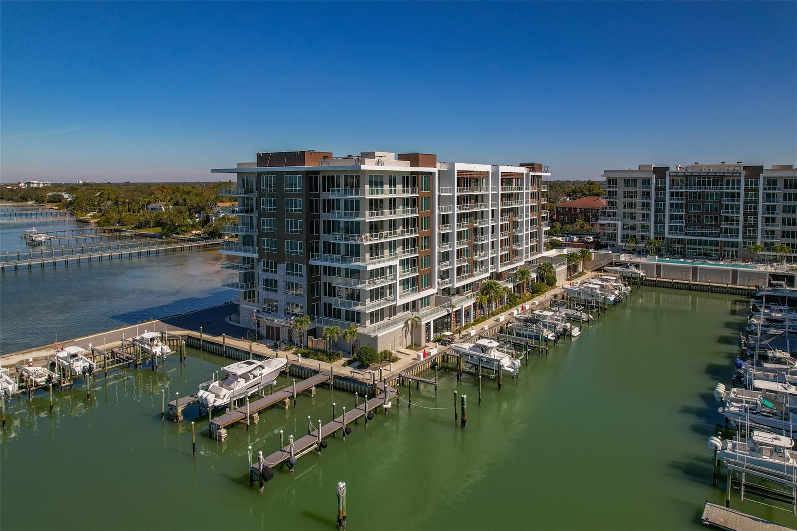 Your Smart Luxury Awaits at Marina Bay 880Discover waterfront living reimagined. This stunning 2021 Marina Bay 880 residence combines breathtaking Intracoastal views with nearly $30,000 in premium smart home upgrades—transforming everyday living into pure sophistication.Smart Living at Your FingertipsElon Home automation with Lutron control** ($19K) — Command every detail: lighting, blinds, cameras, thermostat, TV, and music from your phone or touch padSurround sound** in den and master bedroom ($2,500) — Immerse yourself in crystal-clear audioOutdoor speakers with adjustable lighting** ($1,200) — Entertain in style on your private patioPremium coffee/wine bar** with KitchenAid refrigerator ($4,600) — Elevate your entertainingLuxury laundry room** with custom wall cabinets ($2,200) — Laundry day just got an upgradeThe Complete PictureWaterfront views, resort-style amenities (pool, spa, sauna, fitness center), 24-hour concierge, boat slips, gated security, and designer finishes throughout. Located minutes from Clearwater Beach and major airports.All upgrades included. Move-in ready. Your dream home is waiting. Designer furniture negotiable. Under building parking and storage deeded to the unit, along with a highly covenant reserved parking spot on the upper deck.Schedule your private showing today—this won't last long.