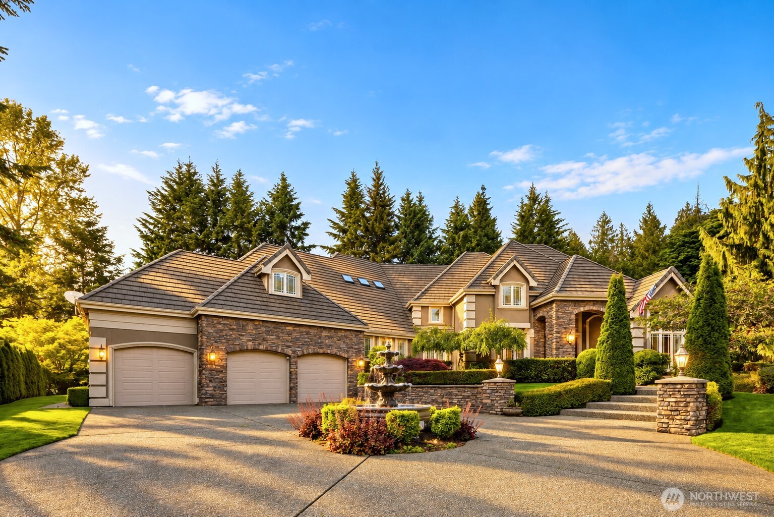 SELLER FINANCING AVAILABLE!  Set within the coveted enclave of Gunshy Ridge, this Architectural Digest-inspired luxury estate offers a rare combination of scale, privacy and value on over an acre at the end of a quiet cul-de-sac. Spanning 6,051 square feet, the residence showcases timeless architecture, custom millwork, rich stone and hardwood finishes, soaring ceilings and expansive walls of windows that seamlessly connect indoor and outdoor living. Designed for both everyday comfort and sophisticated entertaining, the home features a chef's kitchen with premium appliances, extensive prep space, a hidden wine cellar and seamless flow into elegant gathering spaces and covered outdoor living areas. The main-floor primary suite offers patio access and a spa-inspired bath, while upstairs you'll find spacious secondary bedrooms, a bonus room and a private theater with wet bar. Outside, expansive level lawns, mature landscaping and exceptional privacy create one of the community's most desirable outdoor settings. Located in the acclaimed Lake Washington Schools, just minutes from Woodinville wine country, Redmond, Bellevue and the Eastside tech corridor. Rarely does a property combine over 6,000 square feet of living space, more than an acre of beautifully usable land, estate-level privacy and this level of value, making it a standout opportunity for buyers seeking luxury estate living without entering the higher price tiers often associated with comparable Eastside properties.