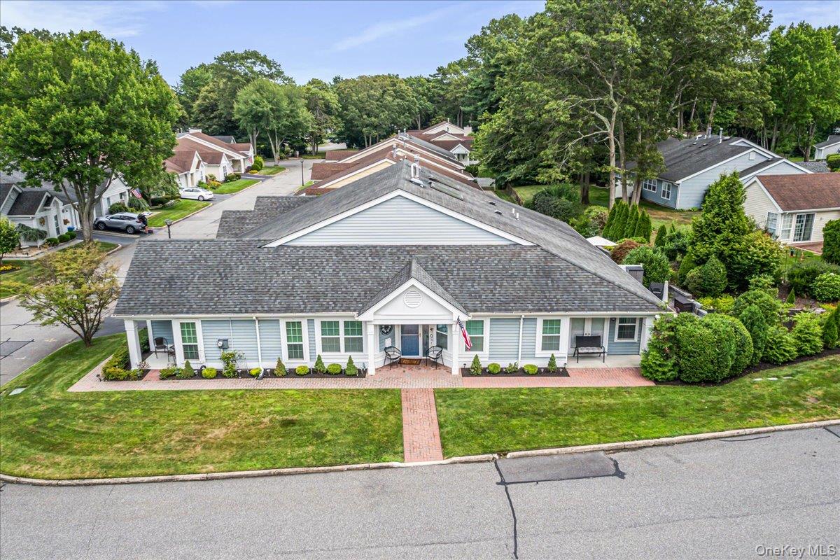 1 Huntington Court in Ridge, NY boasts a carefree, active lifestyle within the coveted "The Glen" 24-hour gated 55+ community. This elegant "Greenport" model residence sits on a
beautifully landscaped corner property. Spanning 1666 square feet, the home features a formal entrance foyer, a gracious living room with vaulted ceilings, and an expansive dining room illuminated by four skylights. The kitchen is equipped with tray ceilings, recessed lighting, and ceramic tile floors, complemented by French doors leading to a sunny den with panoramic windows. The spacious primary bedroom offers vaulted ceilings, a walk-in closet, and a private bath featuring a large shower and exquisite ceramic tile. A second generous bedroom and upgraded guest bath add to the home's appeal. Additional highlights include a laundry room with an updated gas heating system, an attached garage with attic storage, updated CAC, and all vinyl insulated windows and energy-efficient insulated doors. Enjoy a very private backyard oasis with a large brick patio surrounded by privacy trees and hedges. The community provides numerous amenities, activities, and groups. This residence is meticulously maintained, making it an ideal choice for those 55 and older seeking a vibrant community lifestyle.
