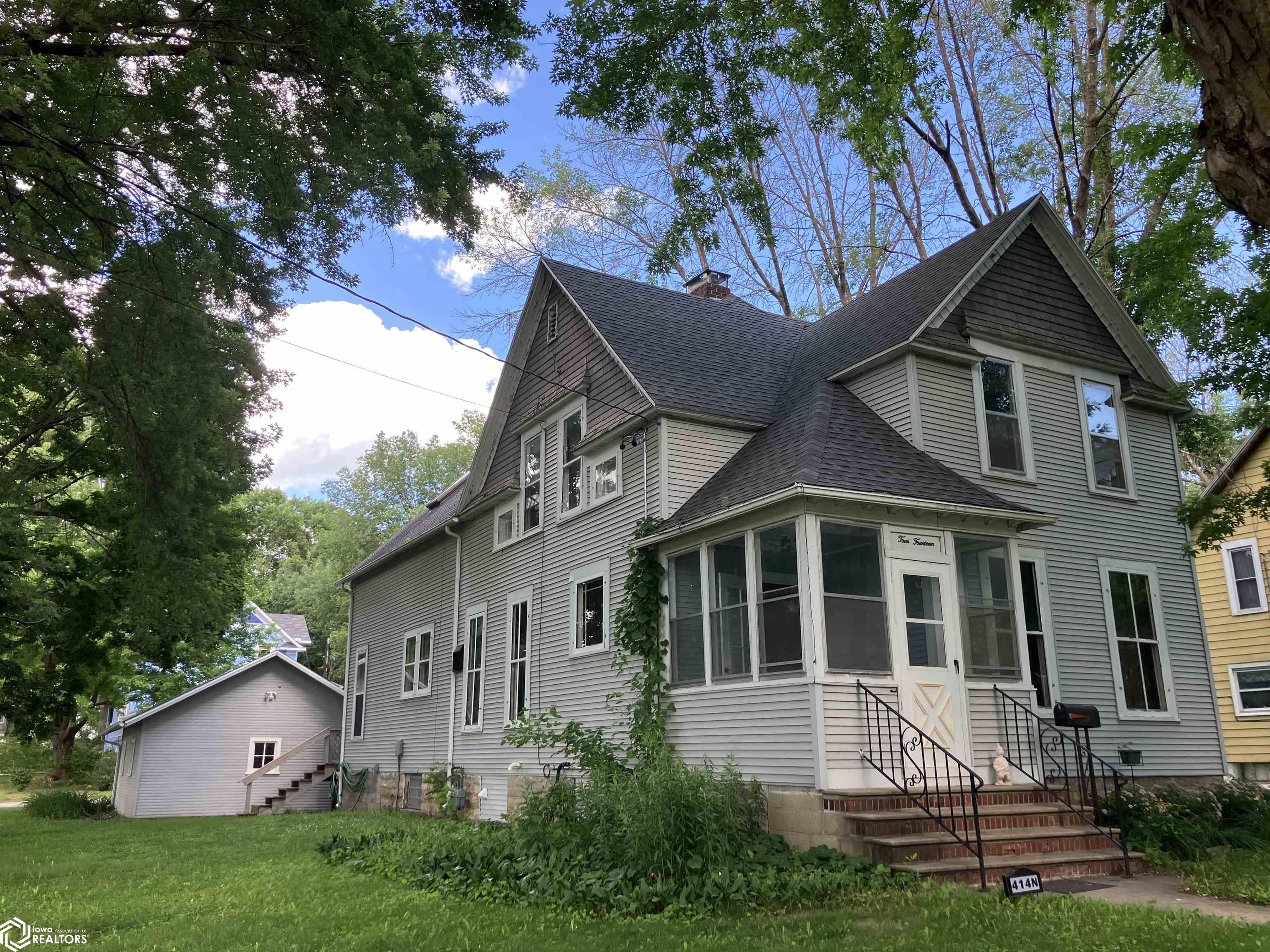 CHARACTER ON THE CORNER!  This turn of the century home located near the lake, Surf District and Downtown has original features including spacious sized rooms, wood flooring, solid doors, trim , leaded windows, foyer with beautiful oak staircase and full bath with claw foot bathtub.  The kitchen has a generous amount of custom oak cabinetry, eating bar, dining space and patio door to deck.  THE UPPER LEVEL FAMILY ROOM is drenched in plenty of natural light with a staircase leading to the kitchen.  This area could also be made into a primary suite, craft room or office and has a loft.  CALL AN AGENT TODAY TO PREVIEW THIS OPPORTUNITY!