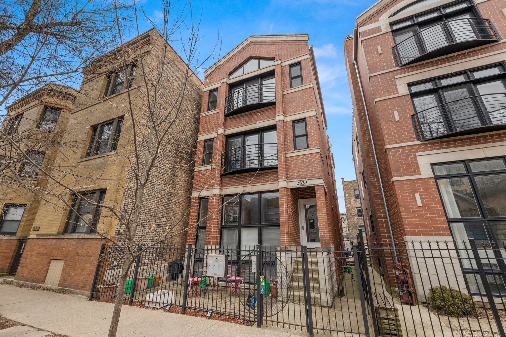 Logan Square Gem! This charming, all brick building is literally a half block from the California Blue Line el stop, but you'd never know it.  The building is tucked away on a quiet stretch of Lyndale and street parking for guests is ample, but there is no better location if you want to walk to some of the best Logan Square coffee shops, stores and eat spots.  It is a 2br 2ba home with elegant finishes, living room has gas fireplace with Juliet balcony, expansive kitchen has stainless steel appliances, granite countertops galore with island and a rare pantry.  Escape to the primary bedroom with private balcony and en suite bathroom encompassing dual sinks, soaking tub and separate shower. Both bedrooms are generous in size. In-unit laundry, private storage closet and exterior parking space complete this home.  Brand new 2022 roof, low HOA of $158 a month, self managed,  with no rental restrictions.